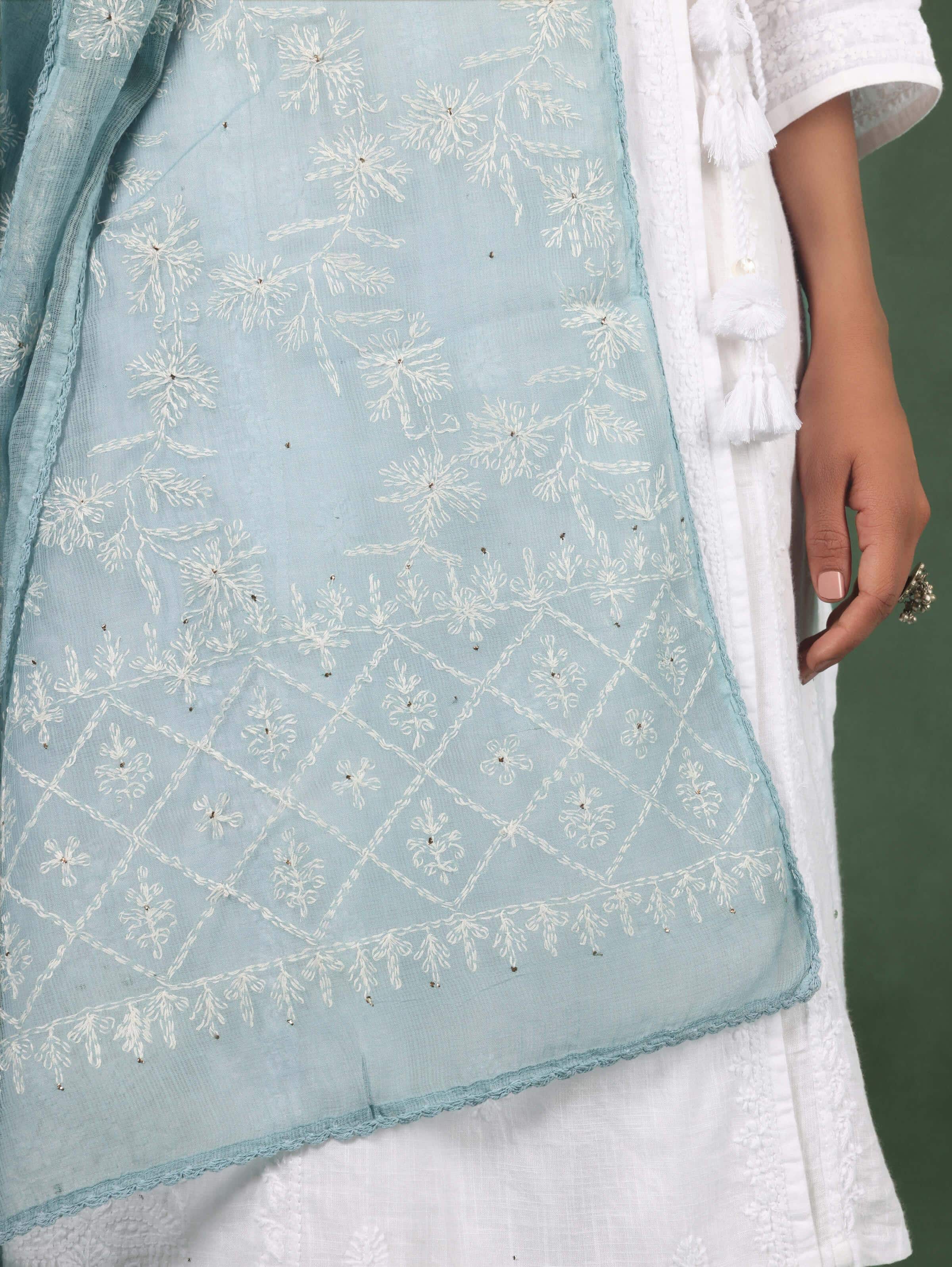 Detail shot of hand-embroidered patterns on aqua Chikankari dupatta
