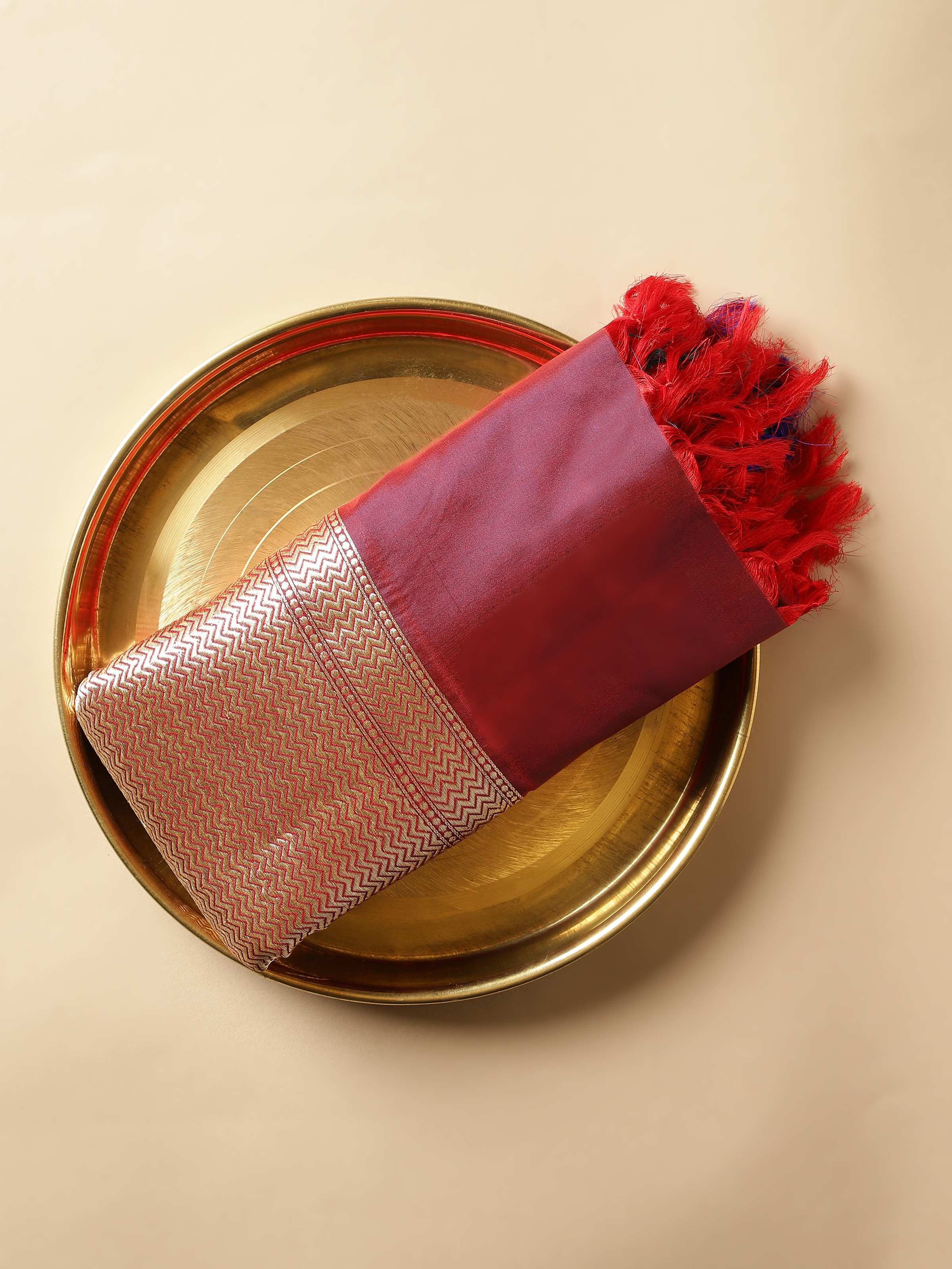 Draped view showcasing full design of red and gold silk Banarasi dupatta