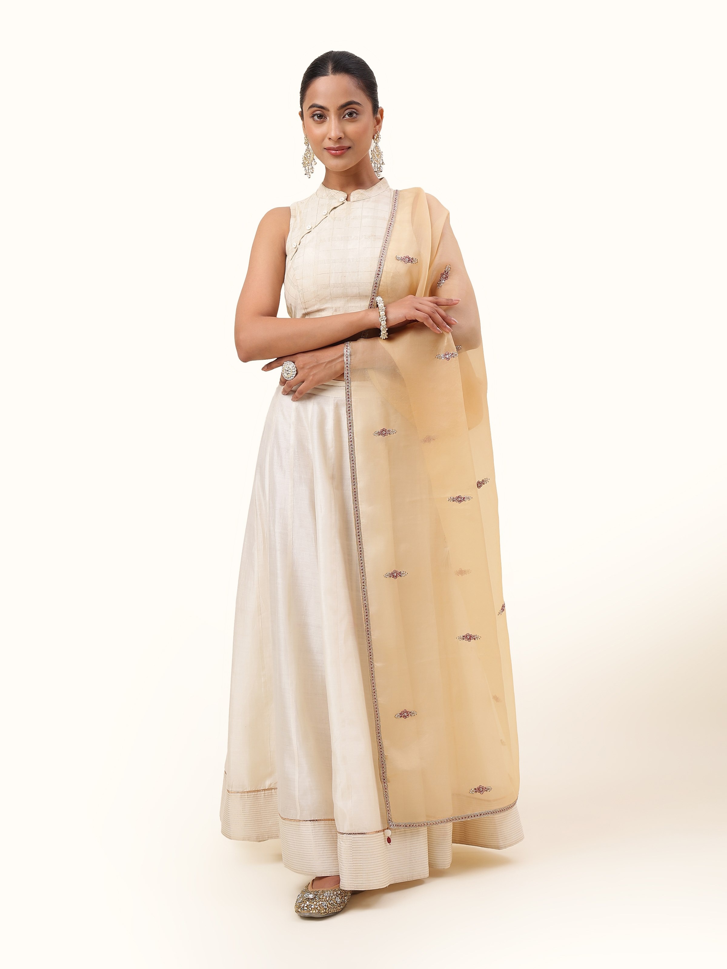 Front view of beige silk dupatta adorned with intricate Zardozi embroidery and golden detailing.