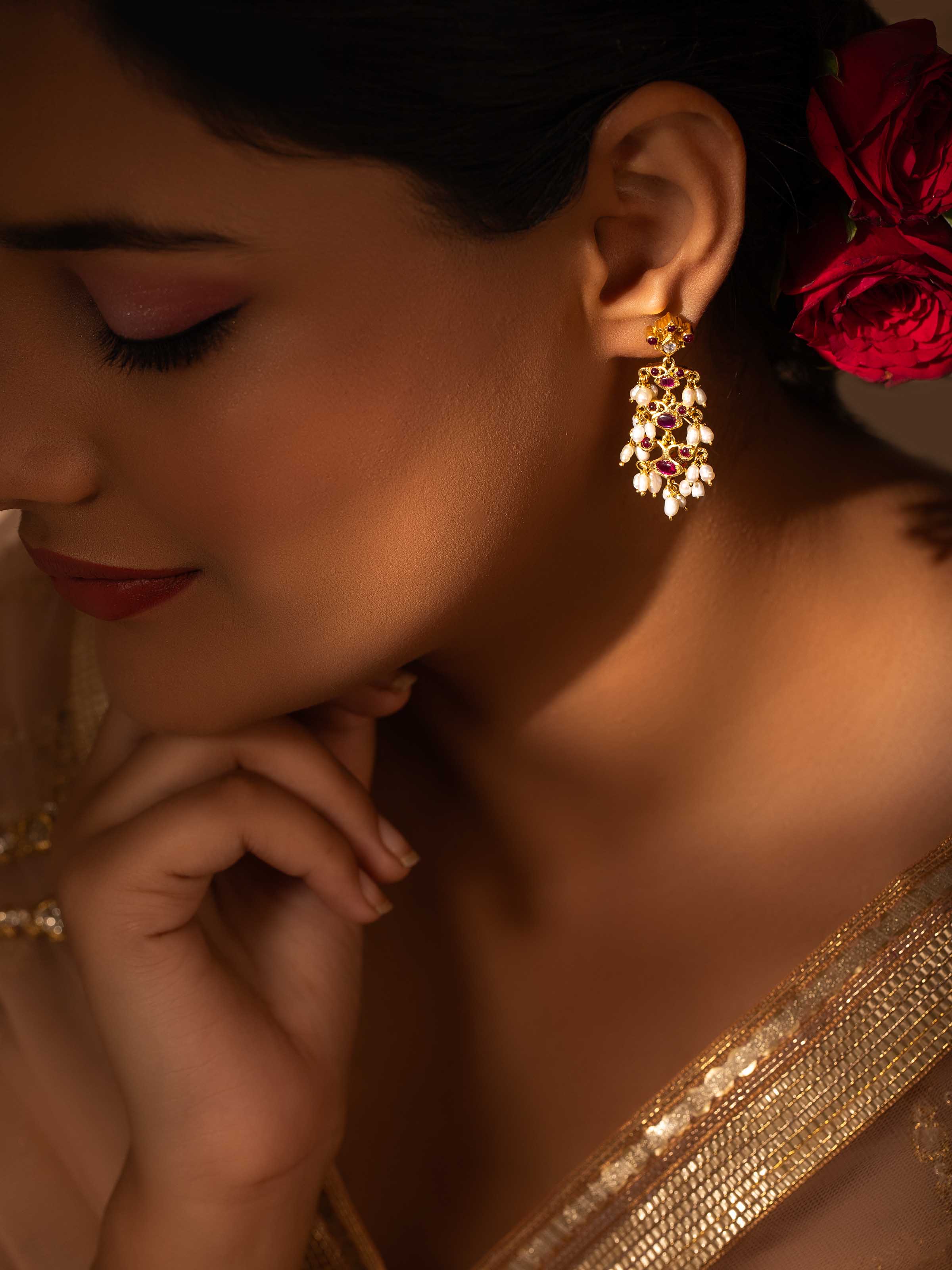 Side view of Swadesh Guttapusalu Silver Drop Earrings highlighting layered design and polished silver finish