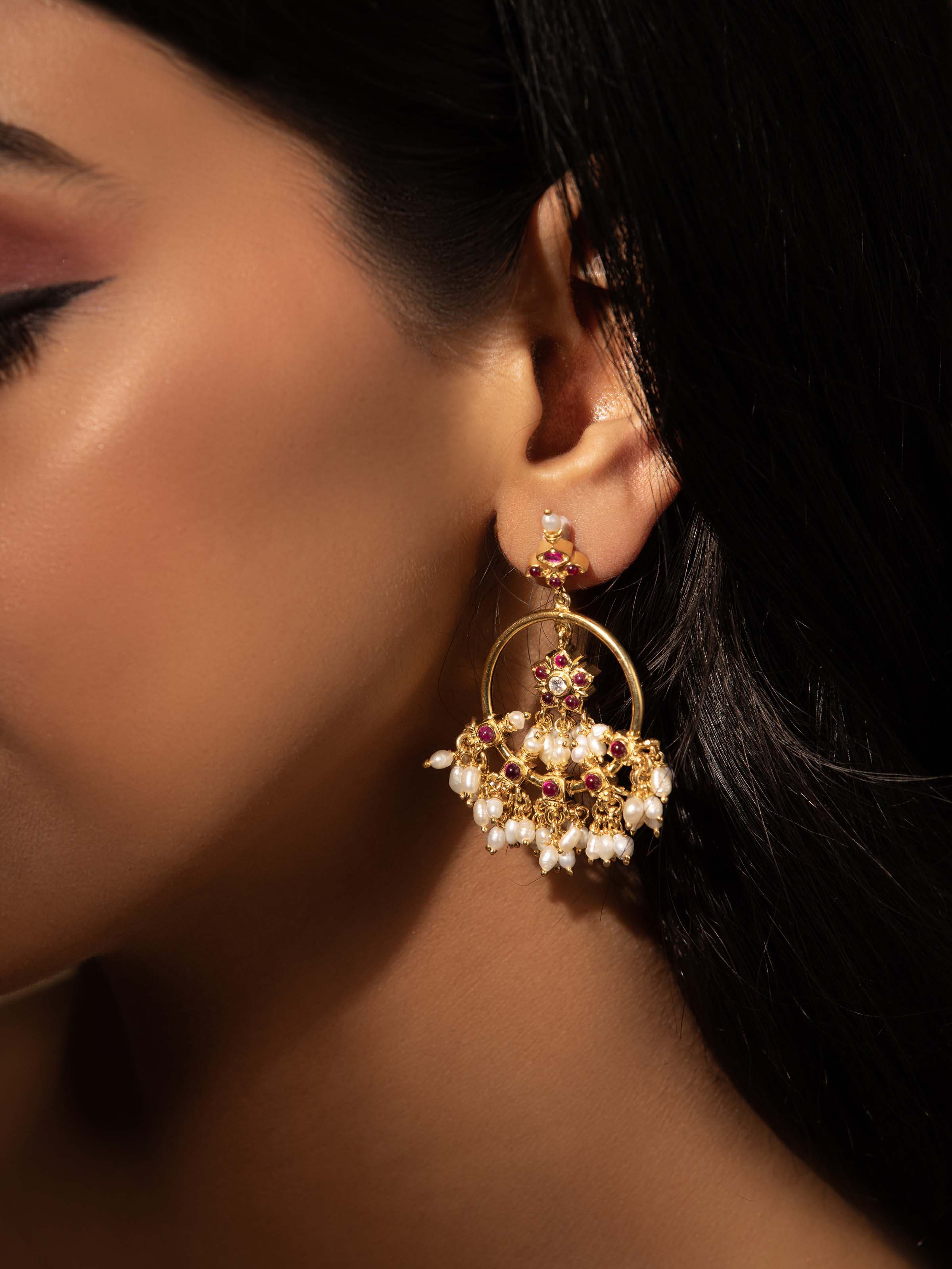 Alternate lifestyle view of Guttapusalu drop earrings styled with festive ensemble.