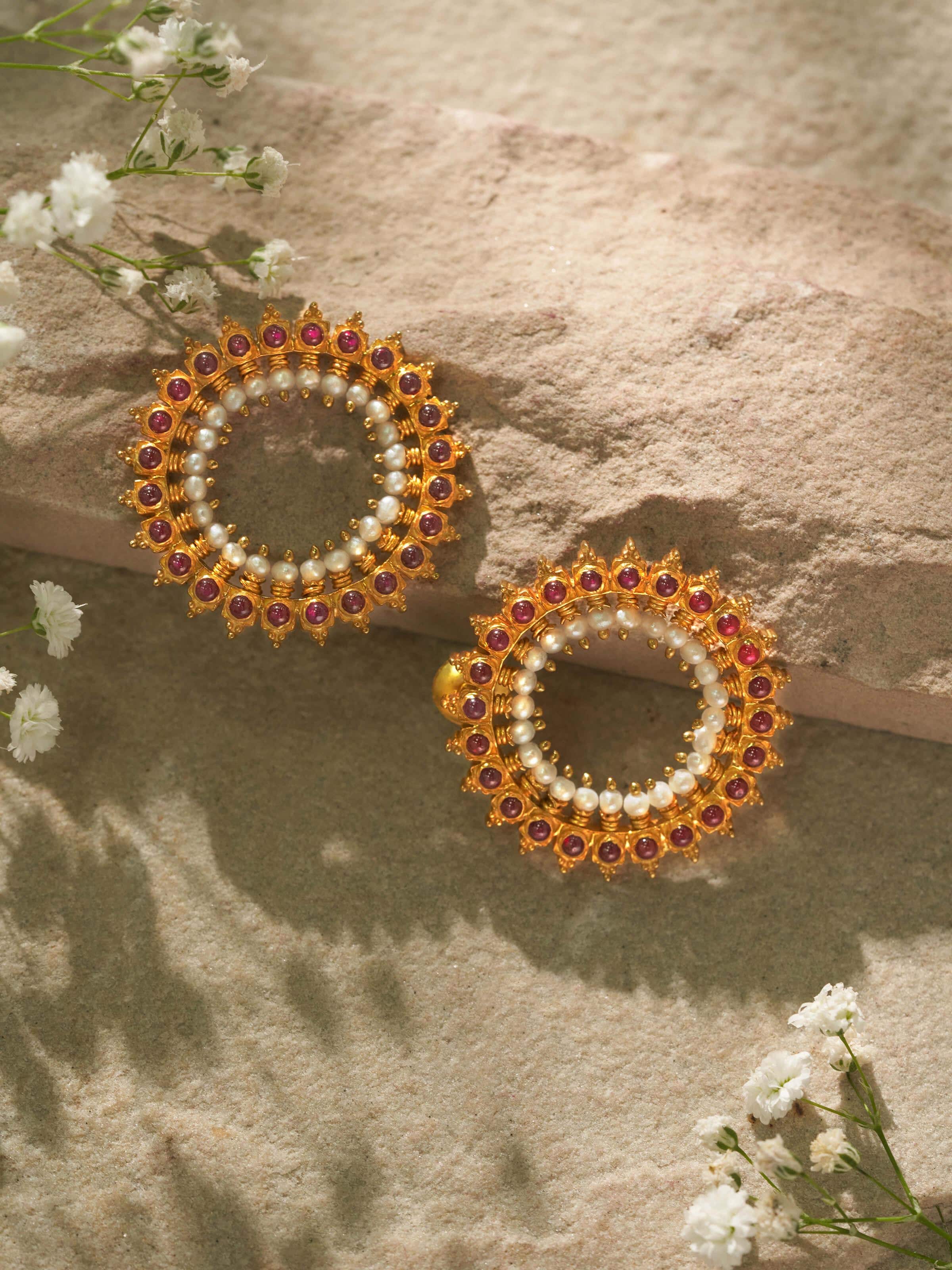 Close-up side angle highlighting handcrafted silver work on studs