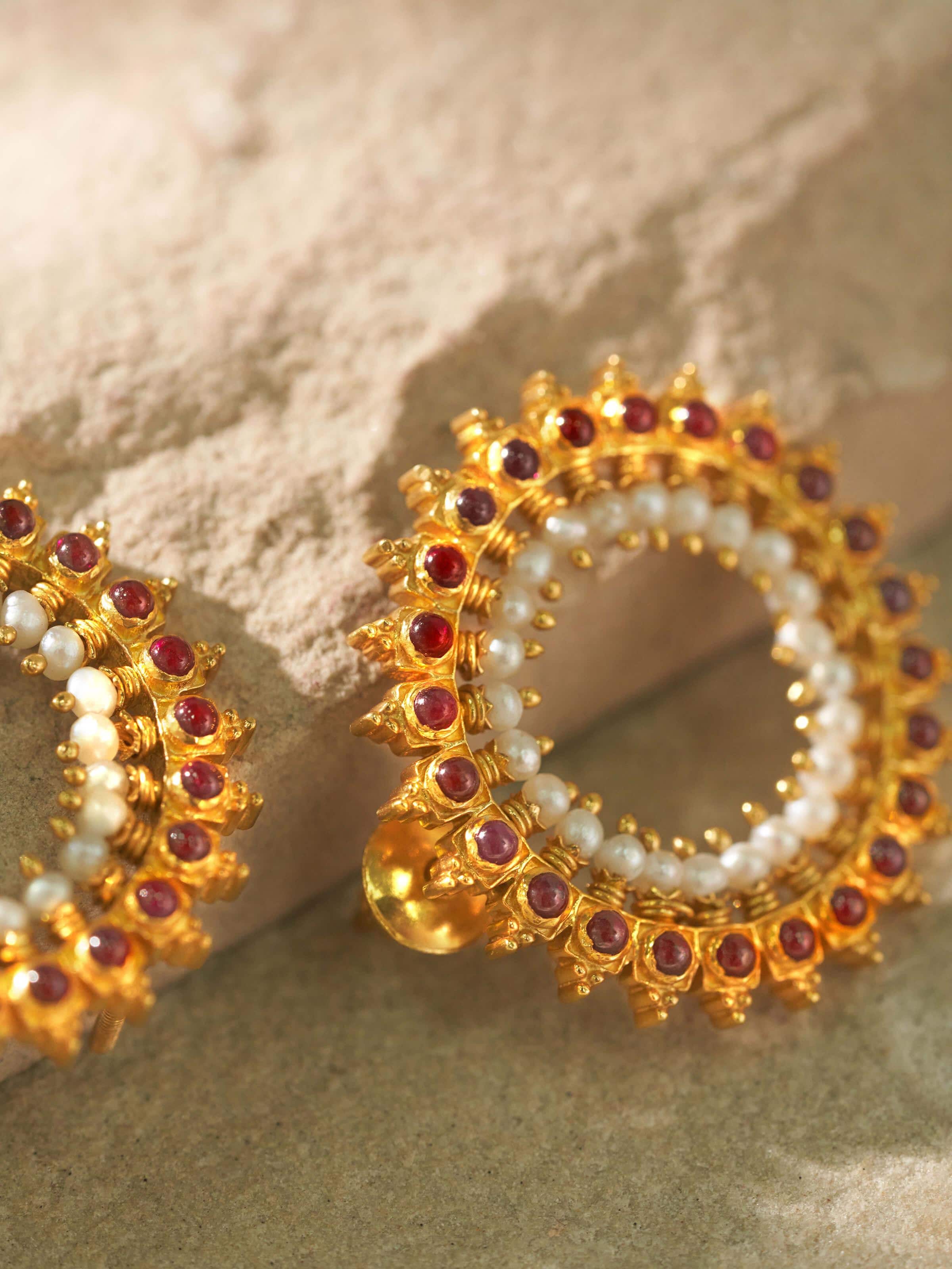 Profile view showing shape and contour of silver stud earrings