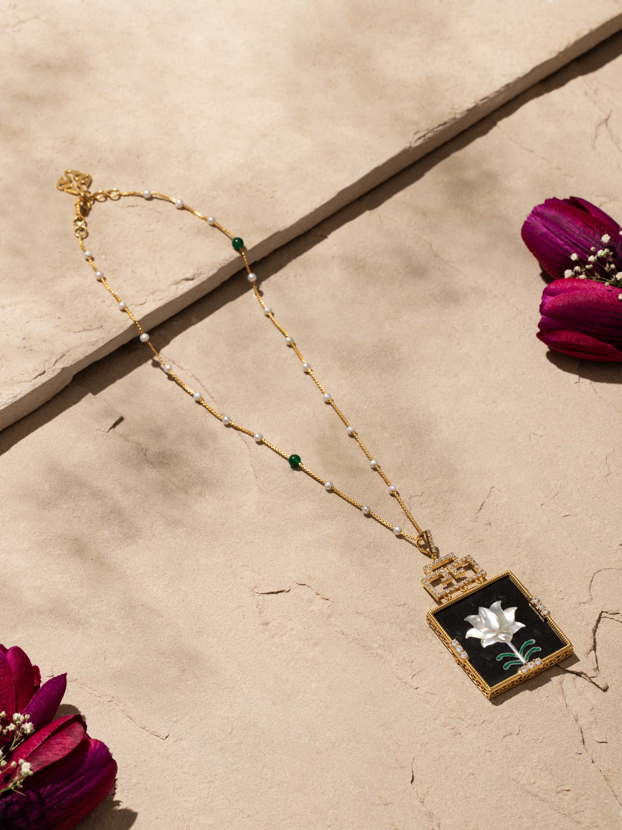 Side view of Pacchikari silver pendant & chain highlighting its detailed silverwork and design.