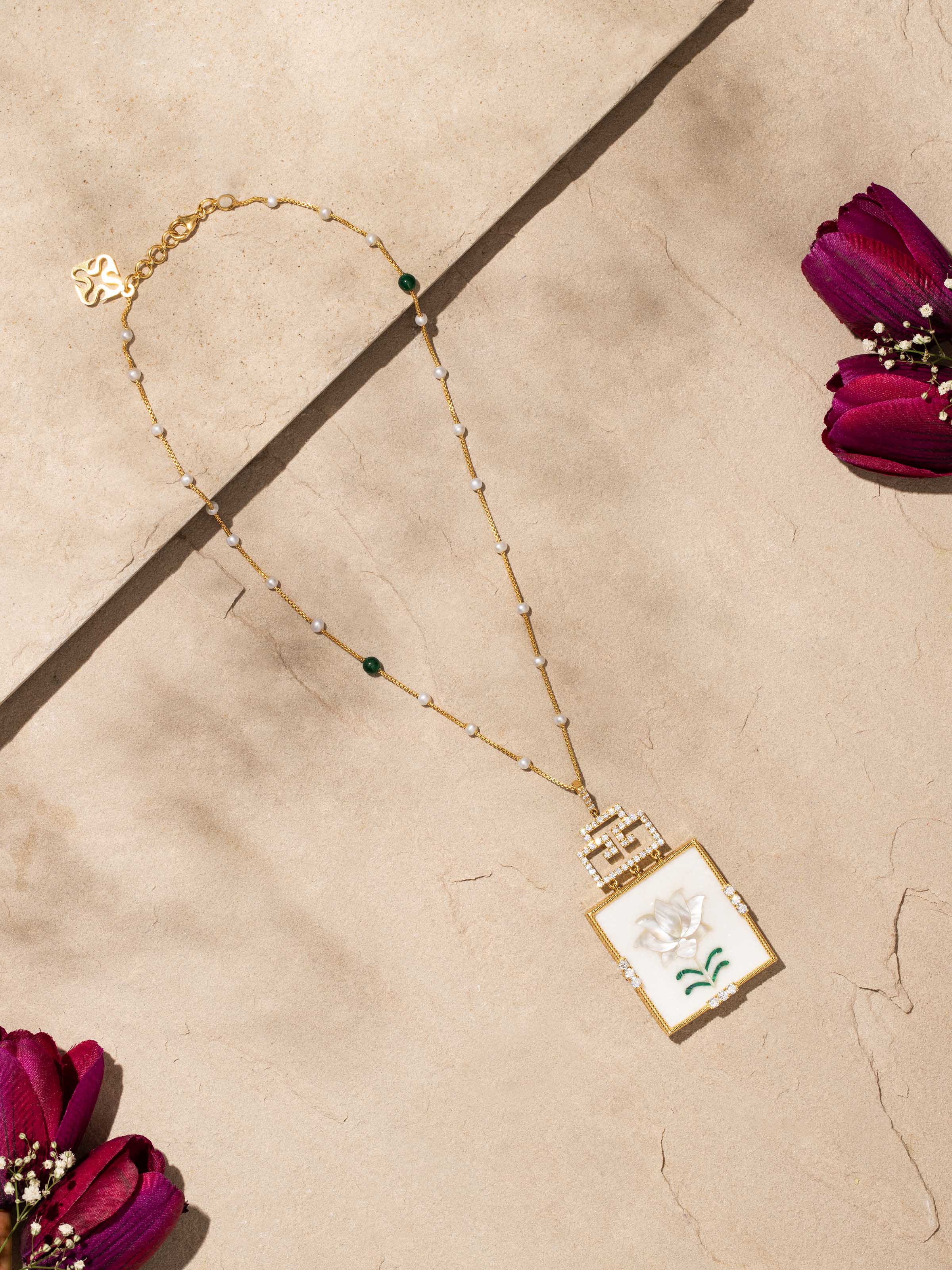 Side view of Pacchikari Silver Pendant and Chain highlighting the detailed silver pendant and fine chain.