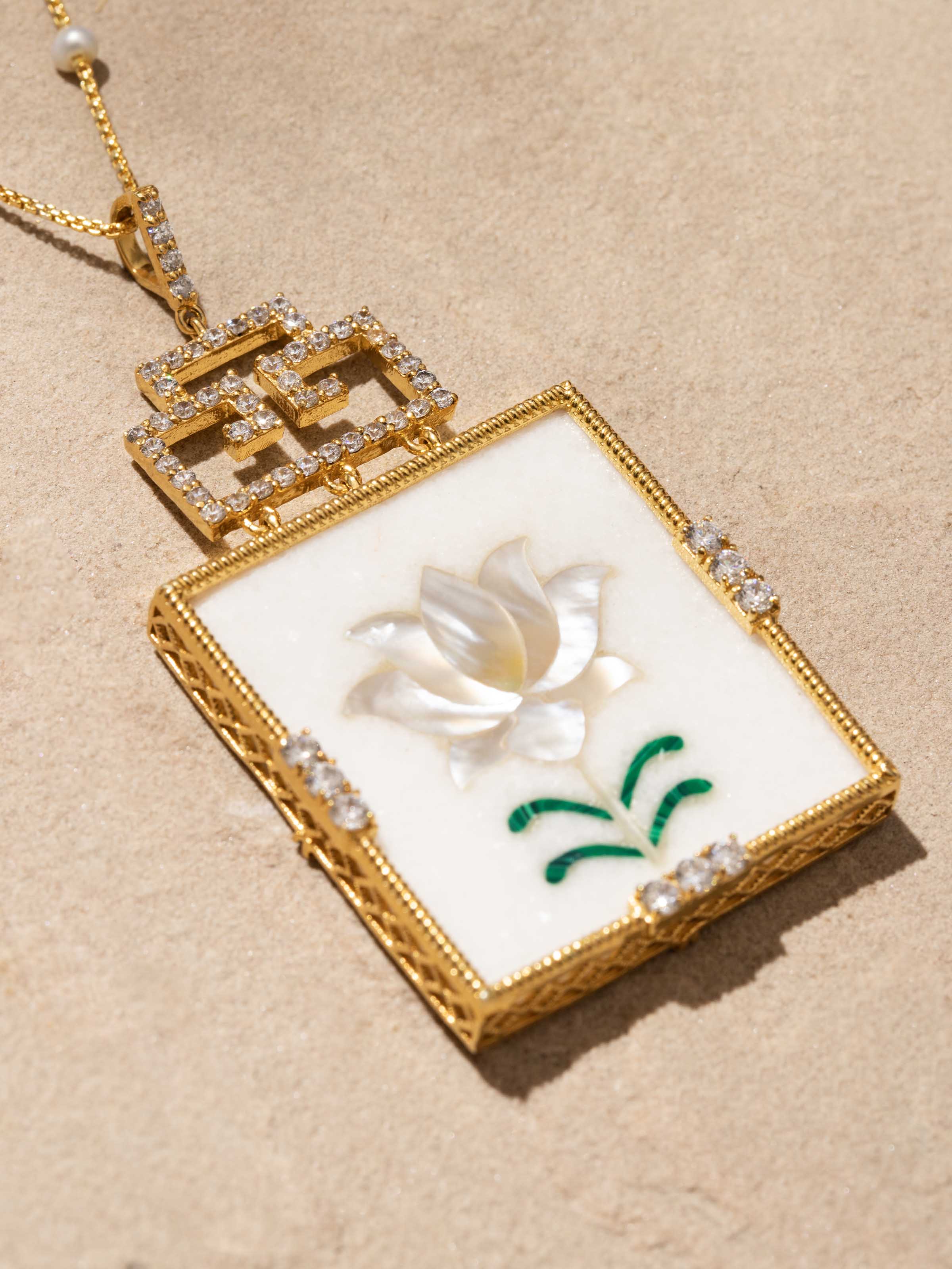 Overhead view of Pacchikari Silver Pendant and Chain highlighting the detailed craftsmanship and elegant pendant design.