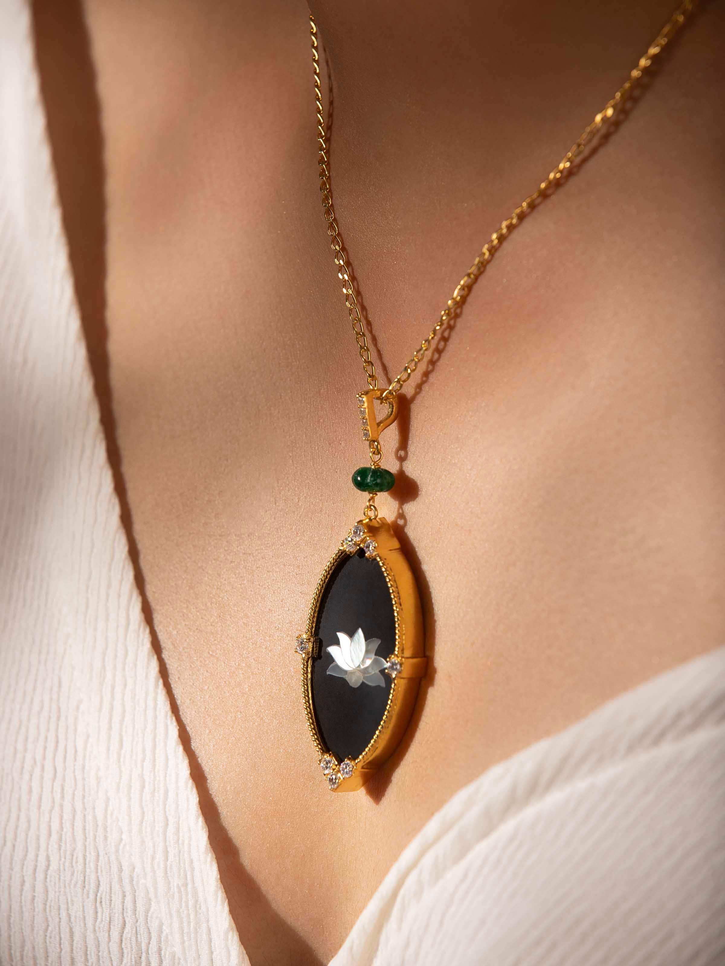 Second lifestyle image highlighting pendant details and silver chain placement