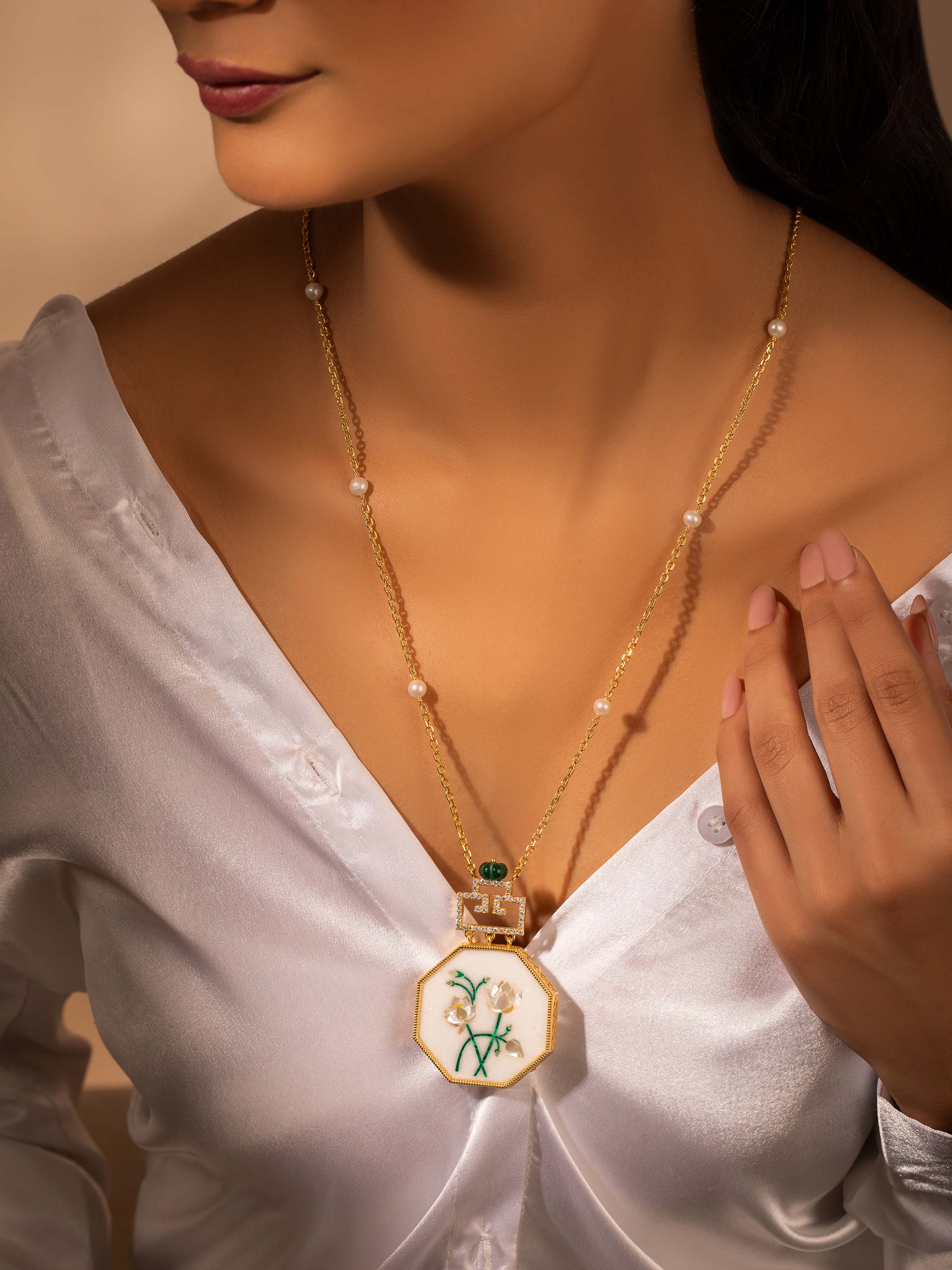 Lifestyle image highlighting Pacchikari pendant styled with traditional outfit