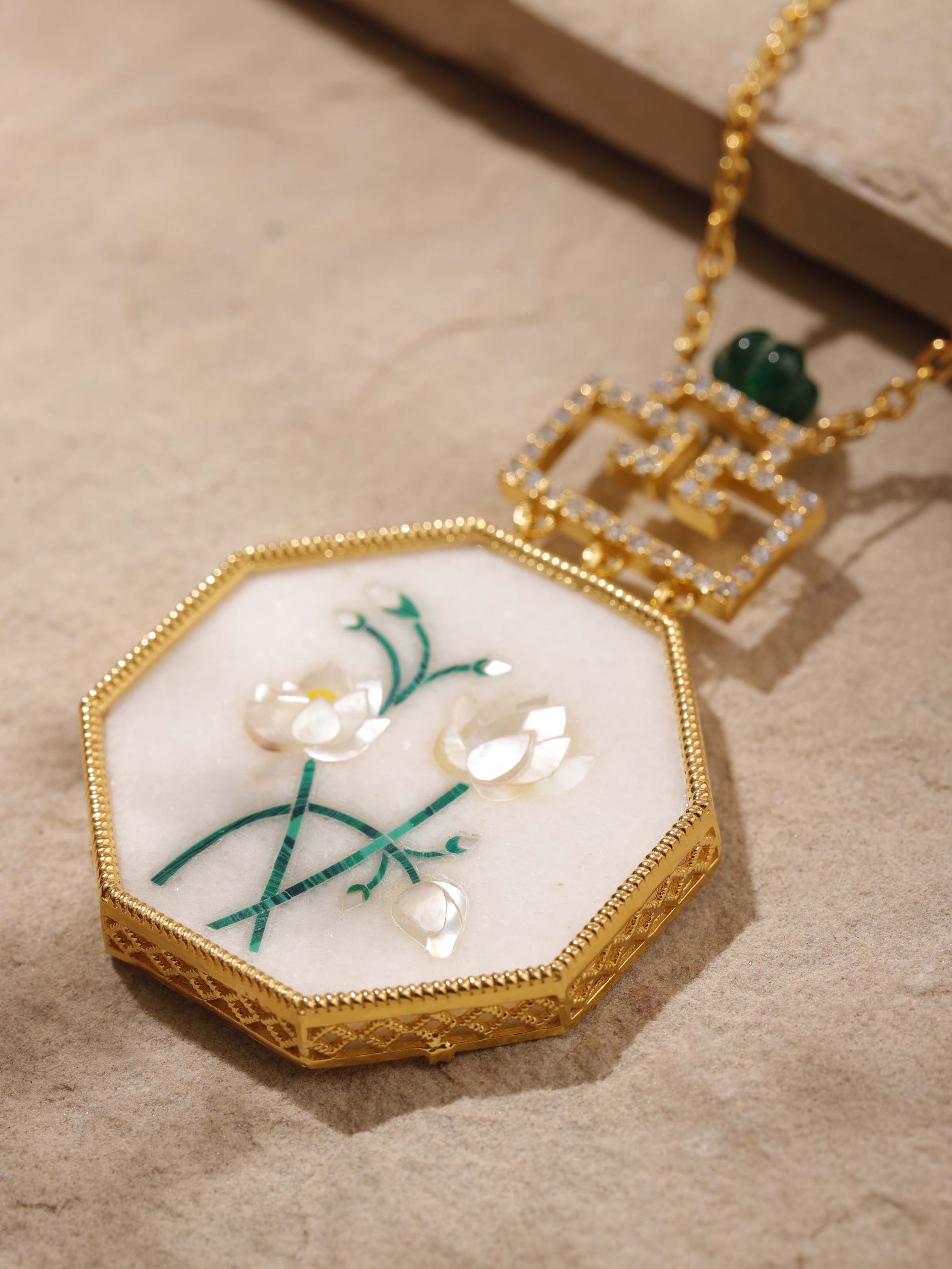 Close-up detail shot of Pacchikari pendant craftsmanship and silverwork