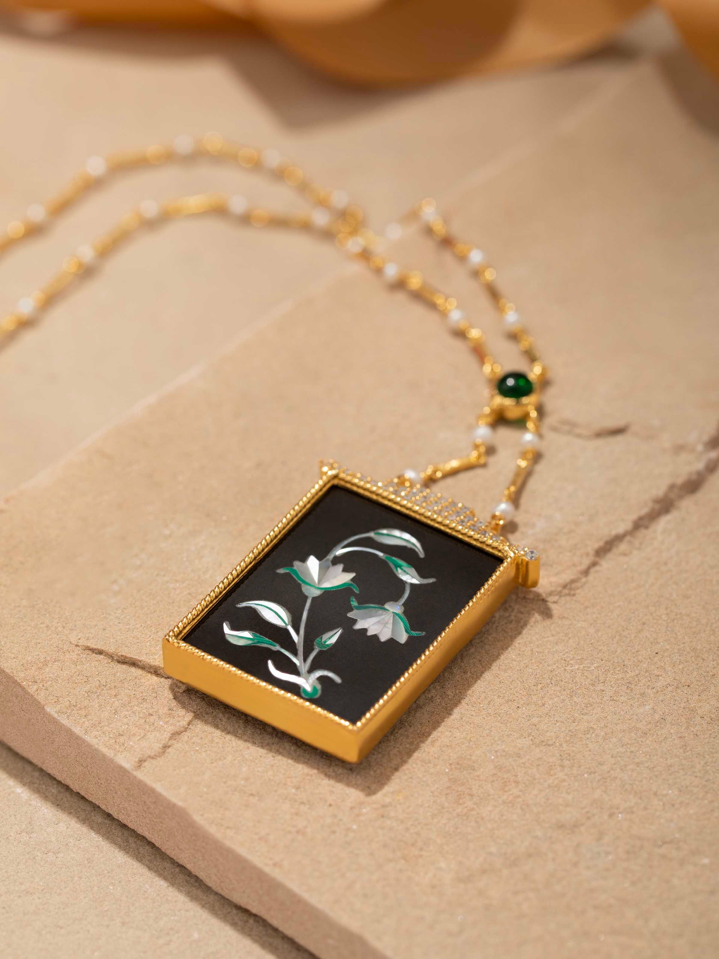 Back view of Pacchikari silver pendant and chain showing the secure clasp and overall design.