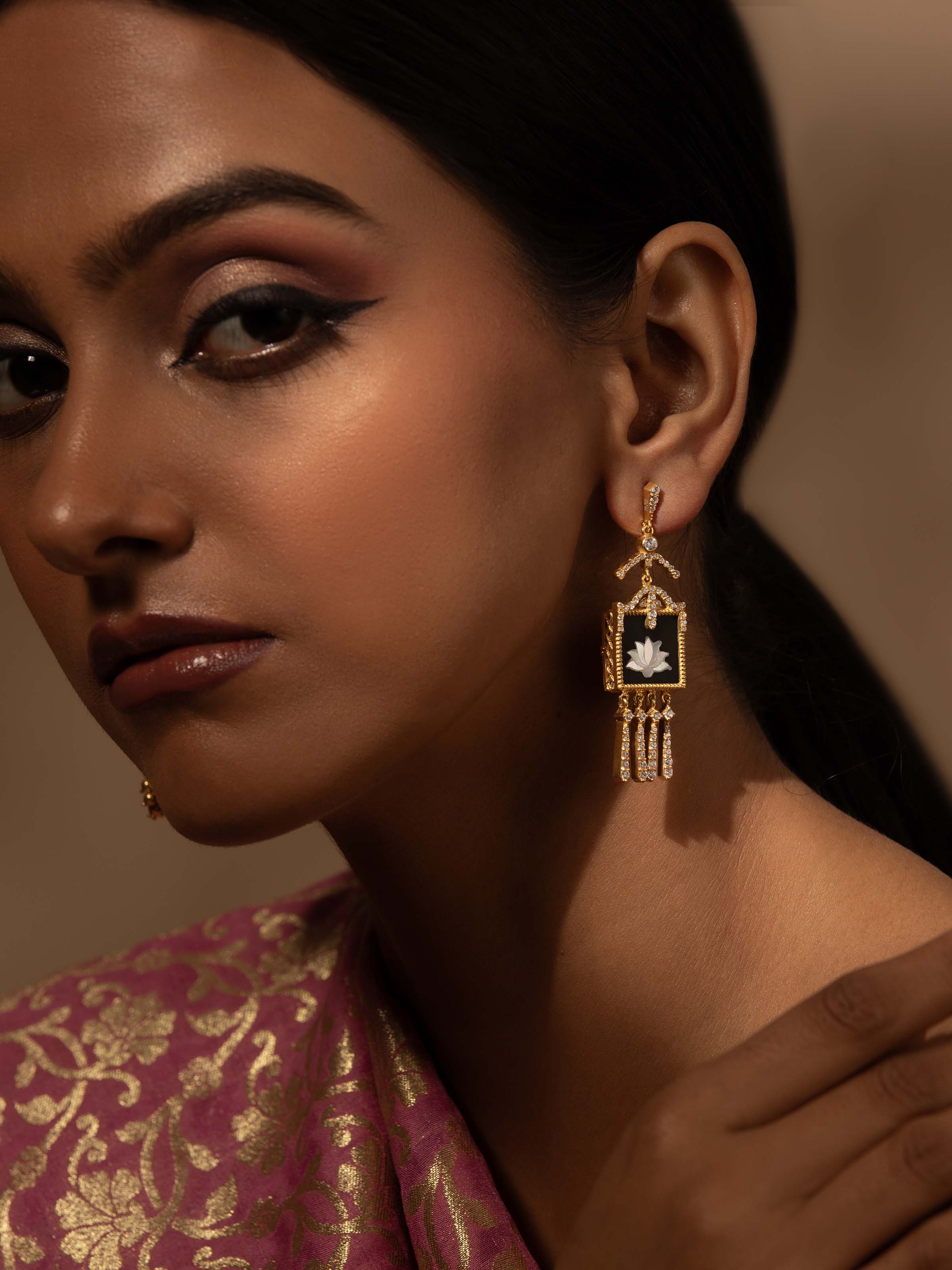 Lifestyle view of Parchinkari drop earrings paired with ethnic wear, reflecting Mughal-inspired style.