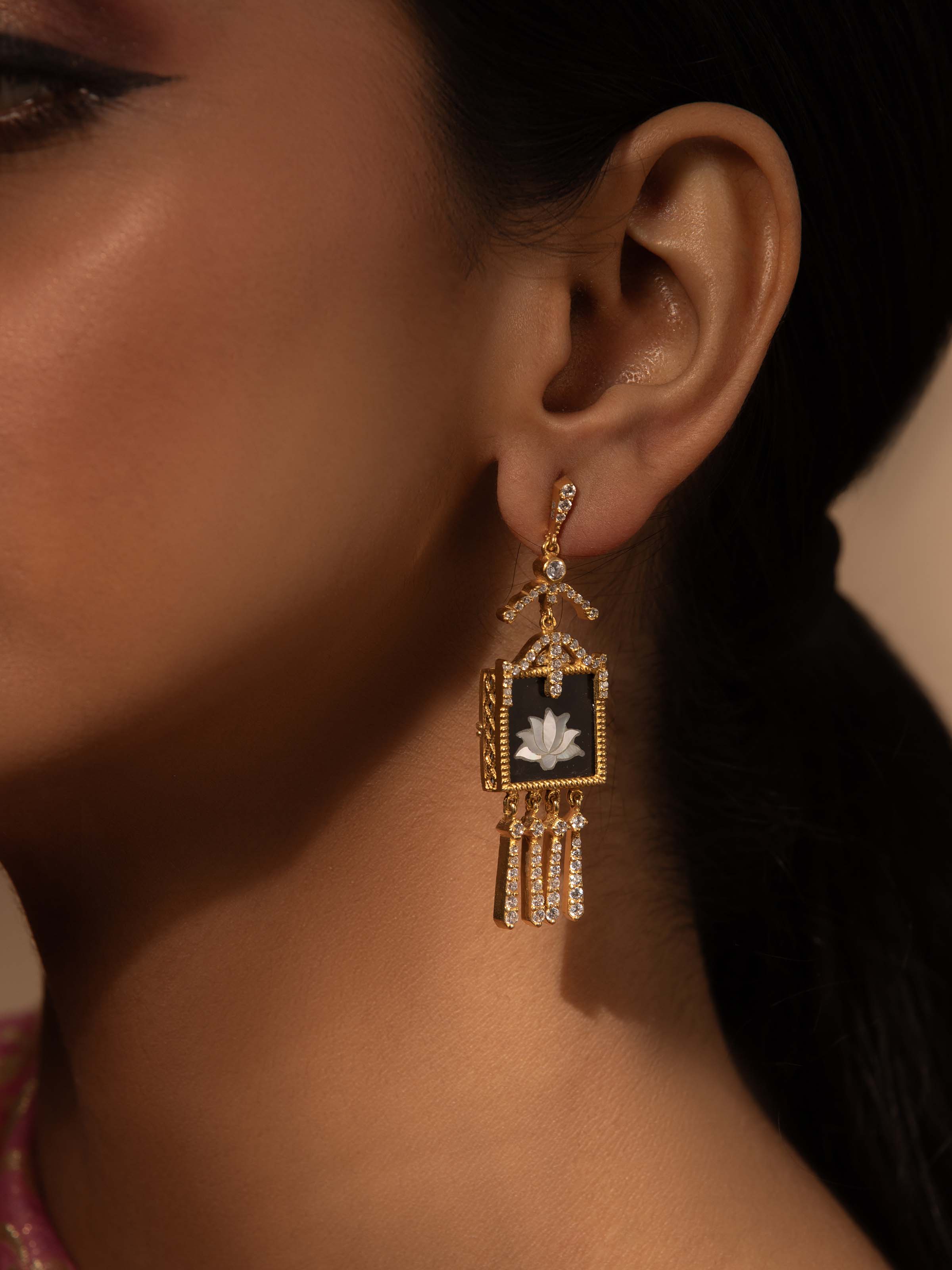 Alternate lifestyle image of Parchinkari silver earrings styled with festive ensemble for cultural flair.