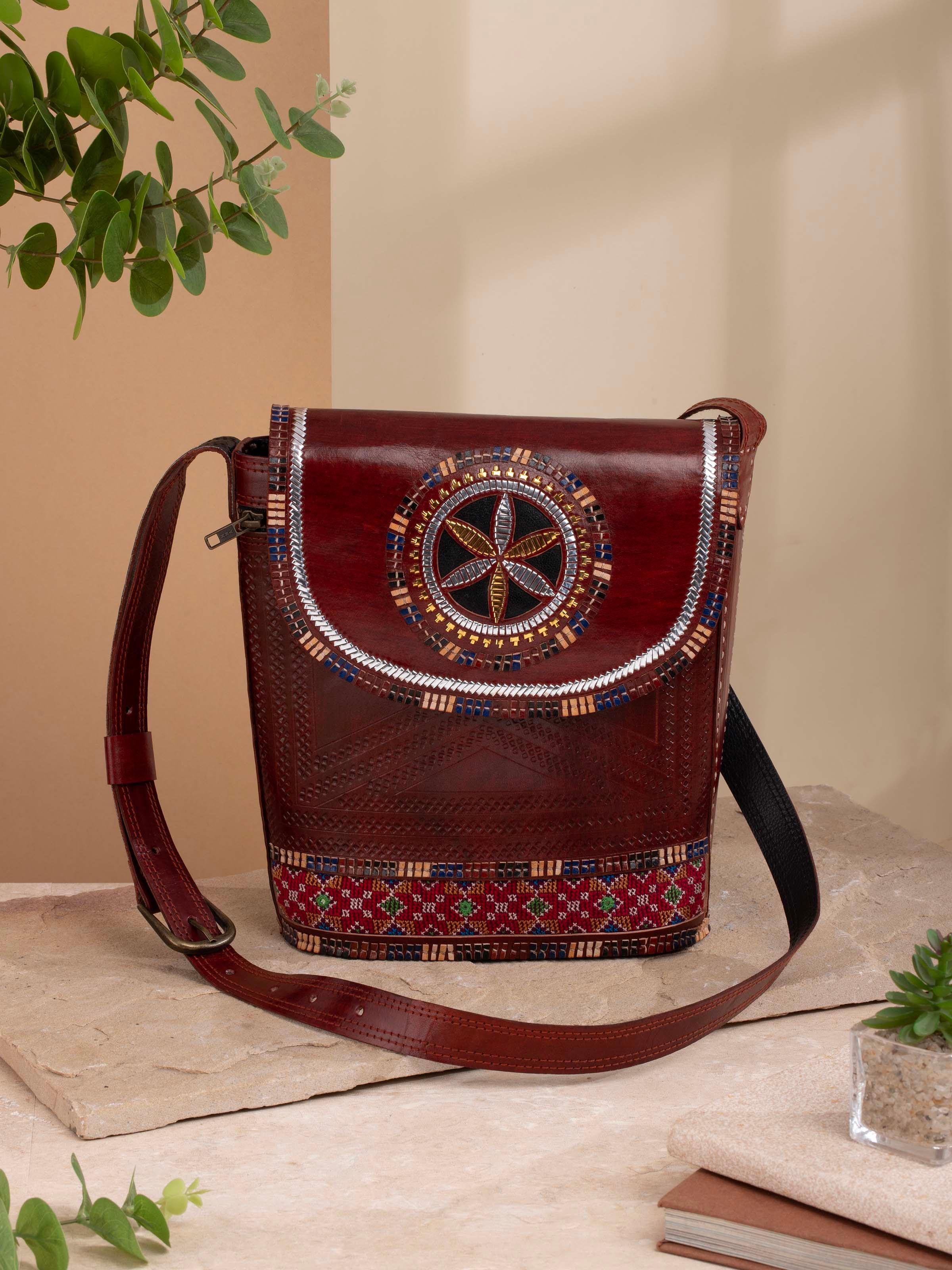 Side view of Kutchi Leather Embroidered Sling Bag highlighting the embroidery and craftsmanship.