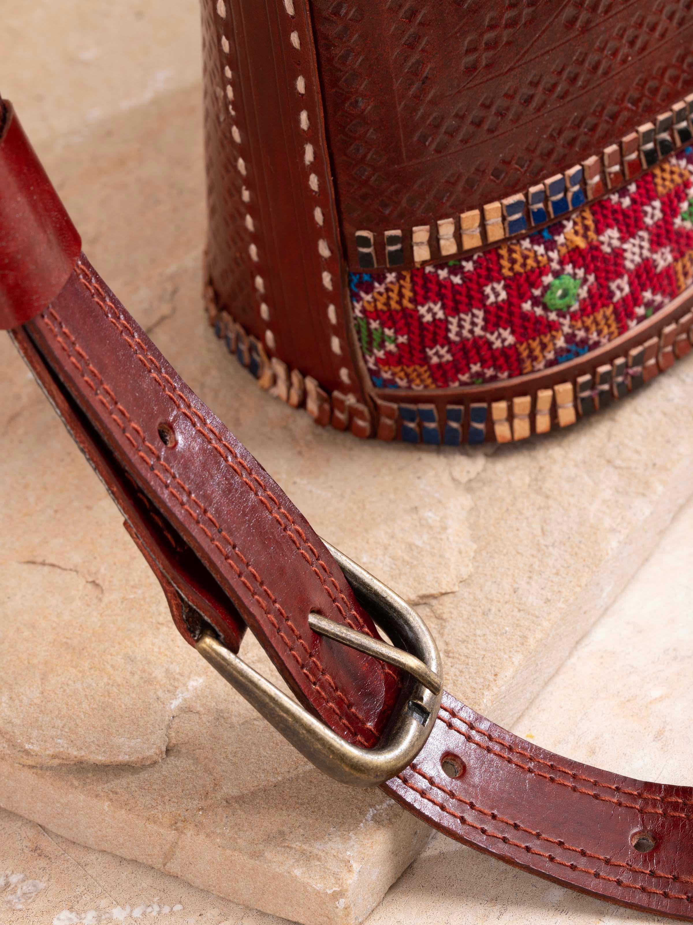 Close-up view of Kutchi Leather Embroidered Sling Bag showing the stitching and material details.