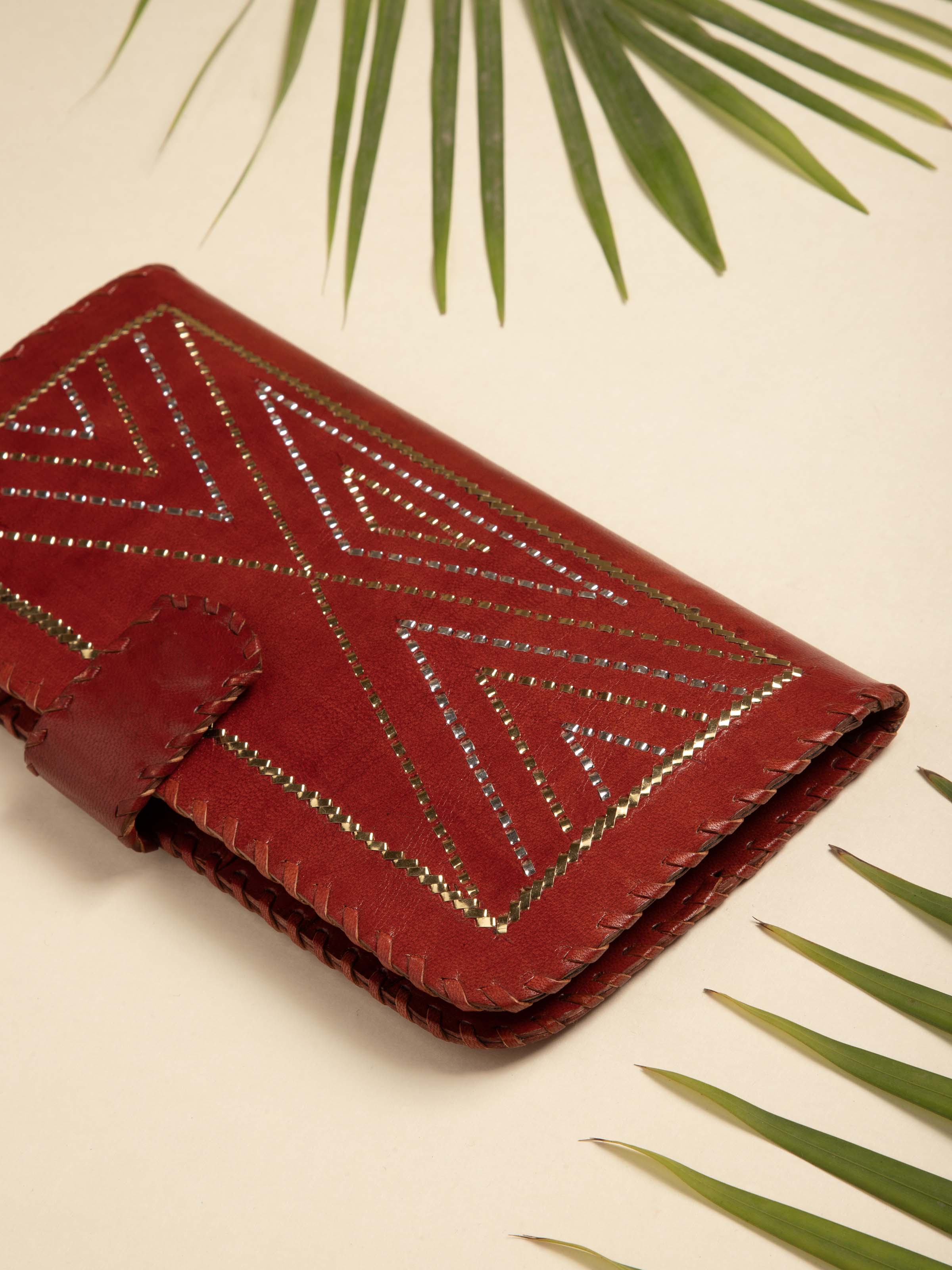 Close-up of Kutchi Leather Clutch with Embroidery showing the fine detail of the embroidery.