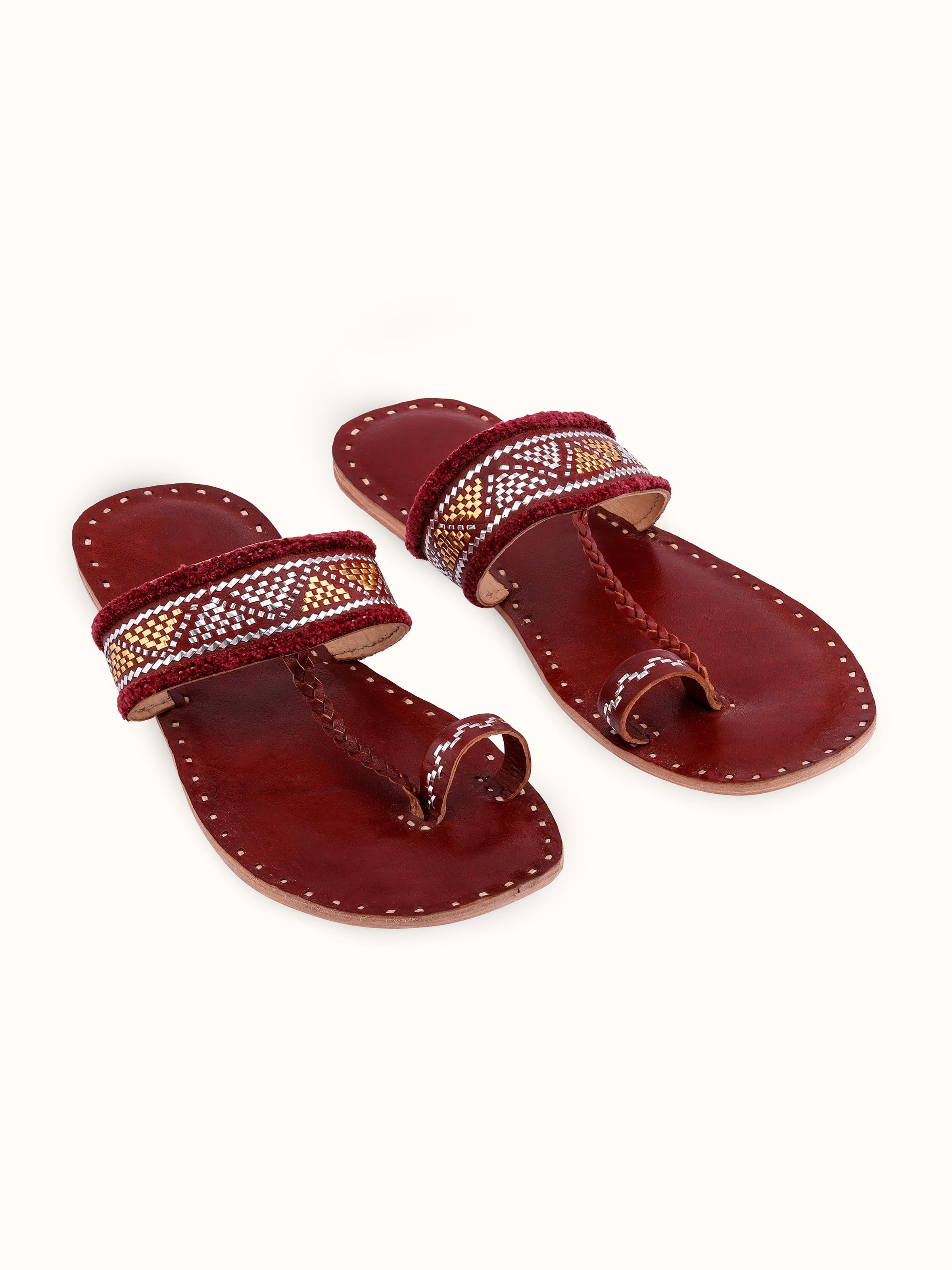 Front view of Tan leather kutch stitched flats with intricate stitching