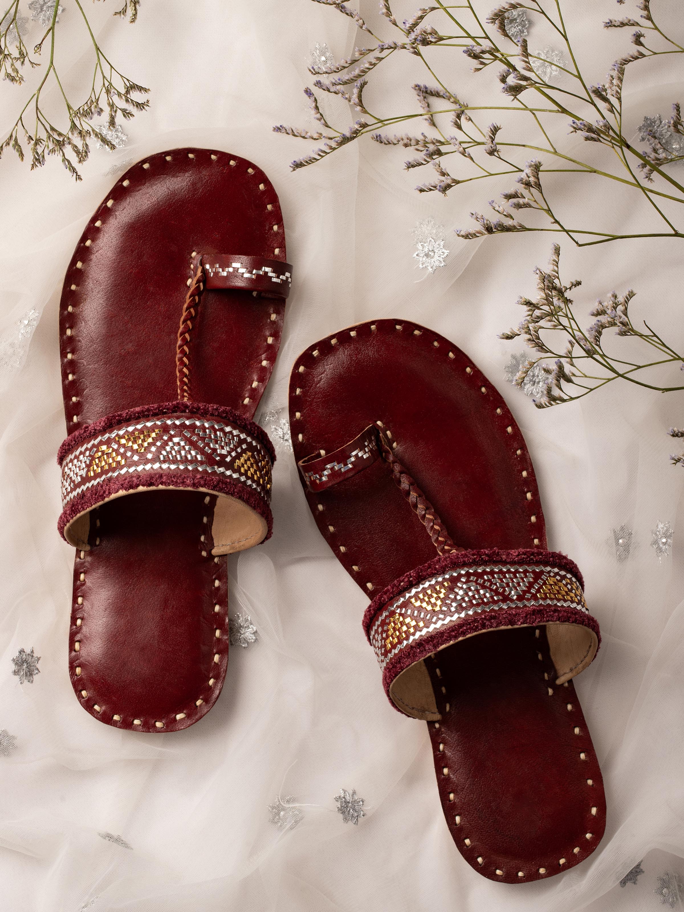 Side view of Tan leather kutch stitched flats highlighting design details