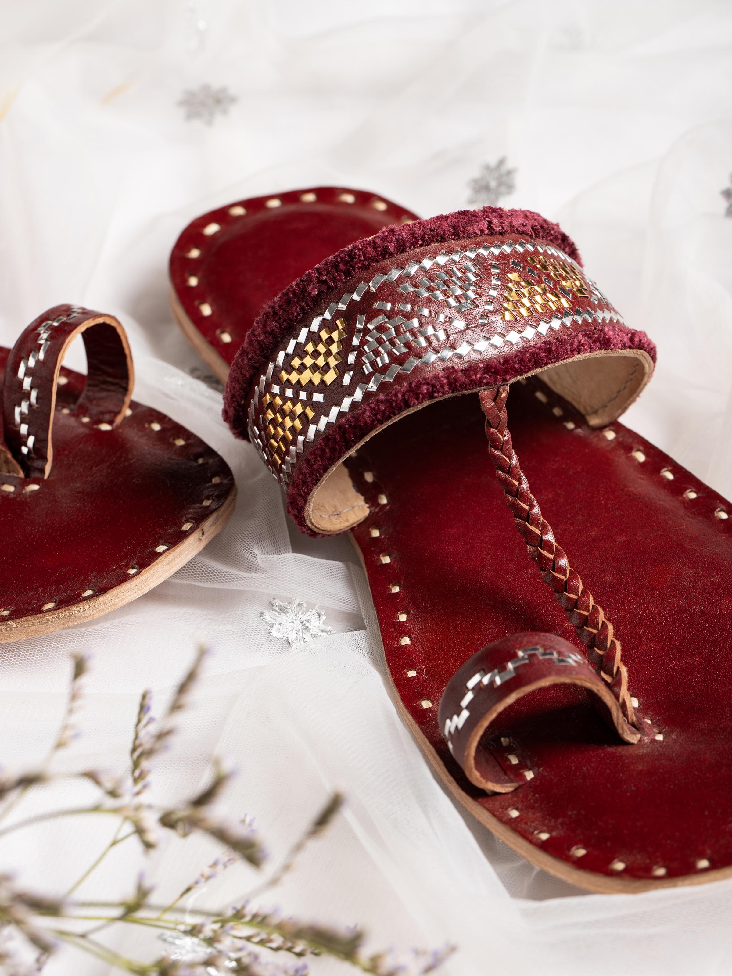 Detailed view of Tan leather kutch stitched flats with stitching pattern