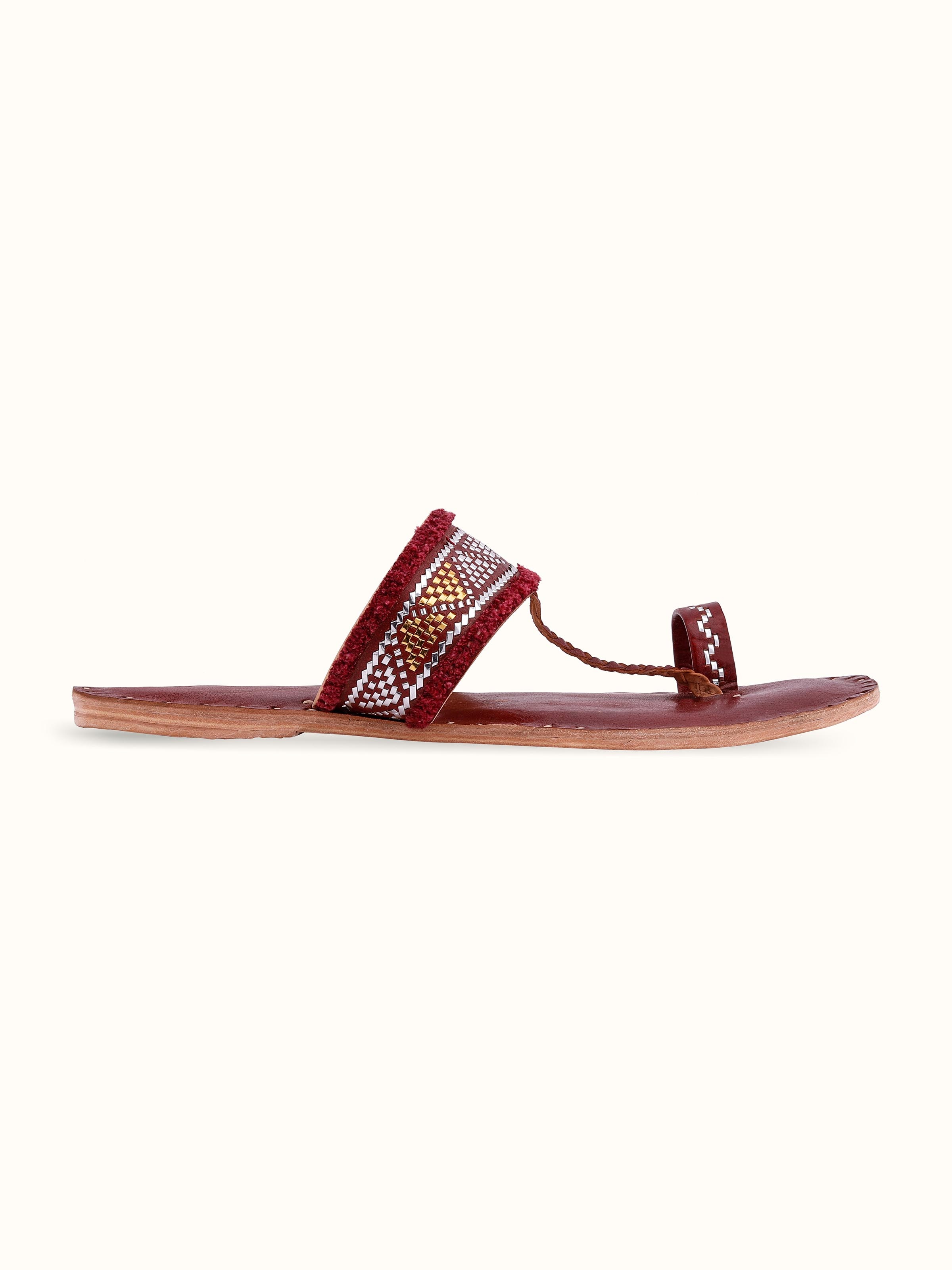 Angle view of Tan leather kutch stitched flats showcasing design and stitching