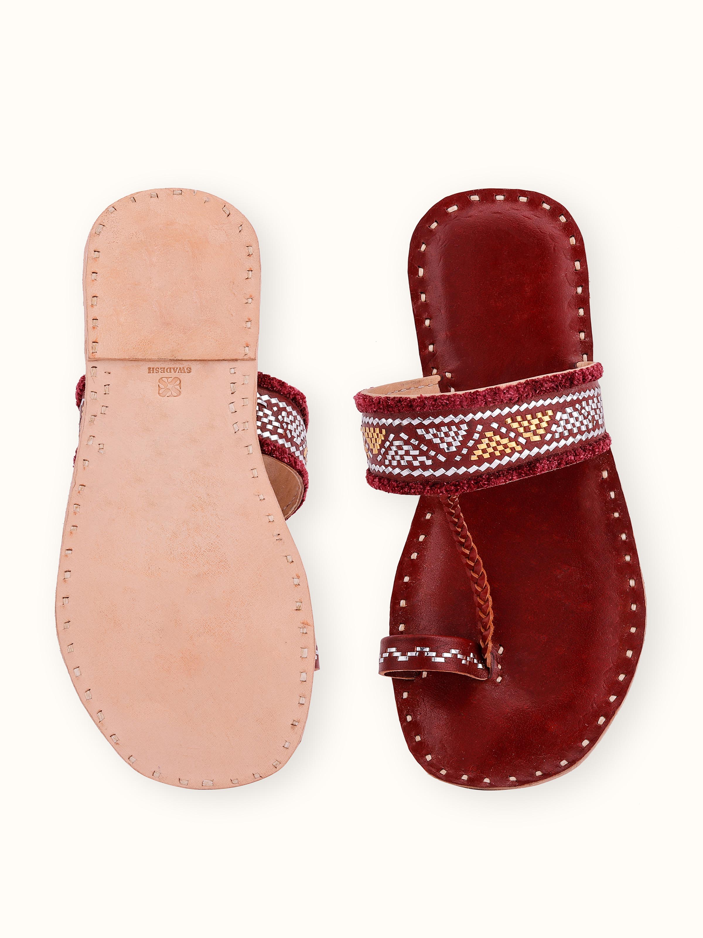 Close-up view of Tan leather kutch stitched flats emphasizing craftsmanship