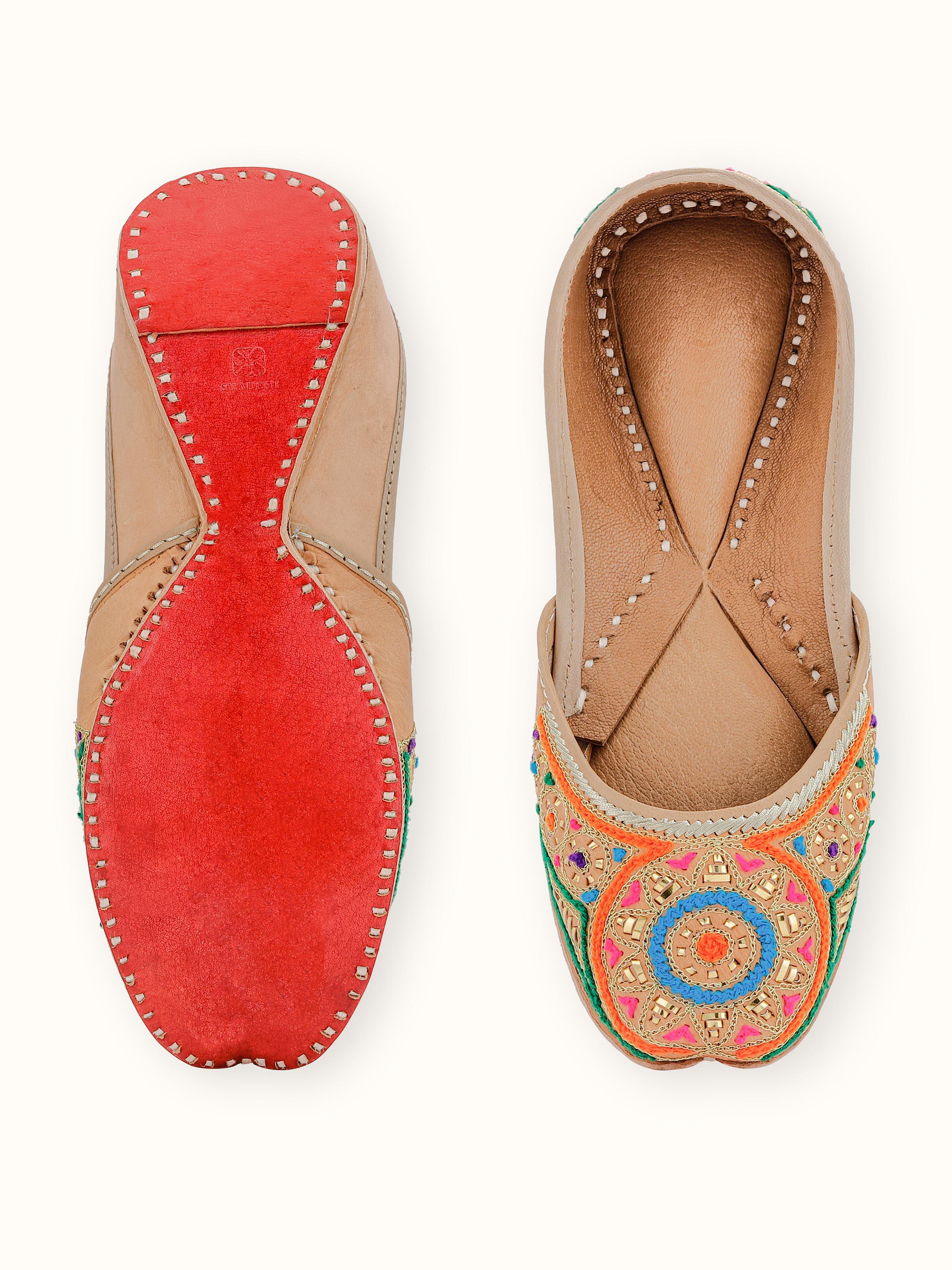 Top view of Tan Leather Haryana Embroidered Juttis displaying the embroidery and overall design.