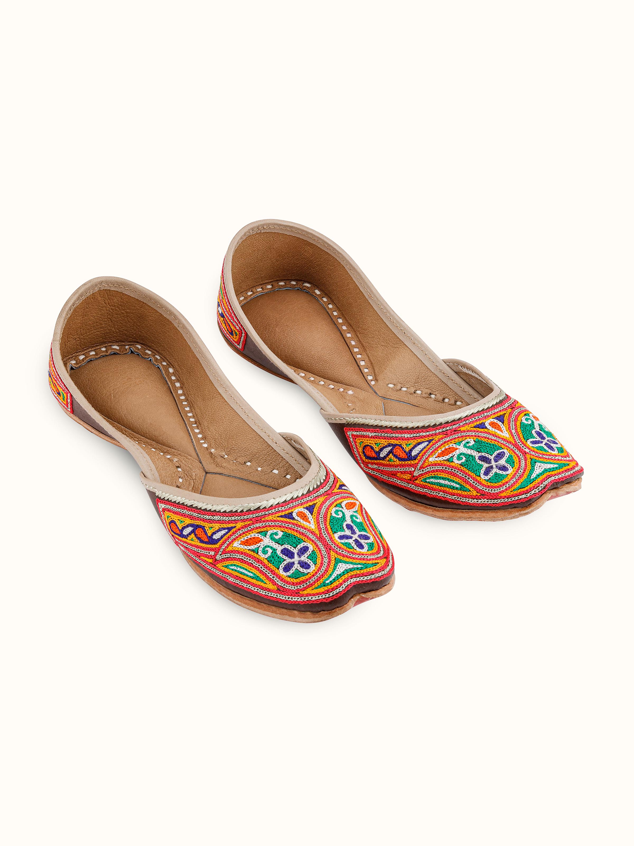 Front view of Tan leather haryana embroidered juttis with intricate embroidery
