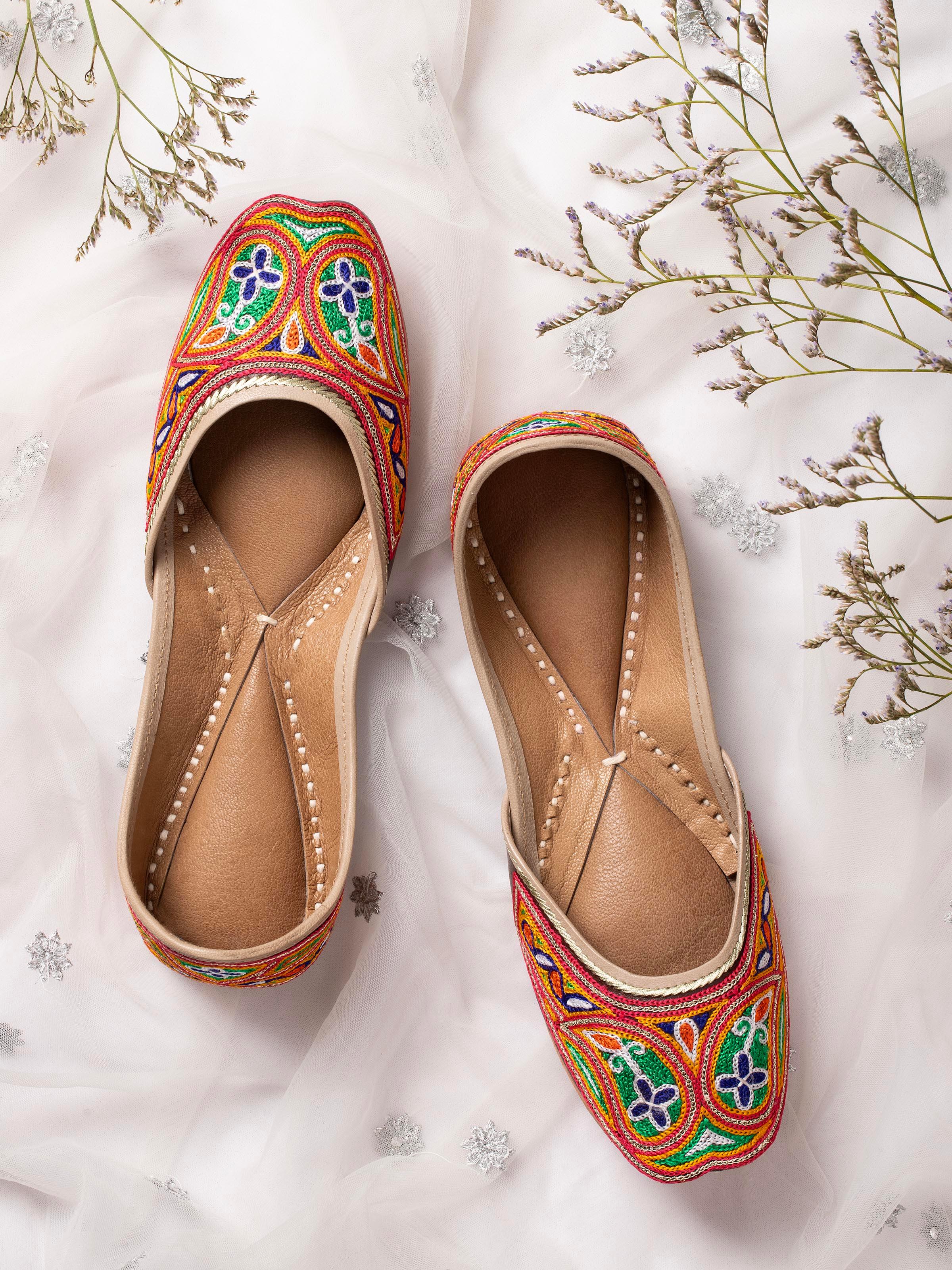 Side view of Tan leather haryana embroidered juttis showcasing embroidery detail