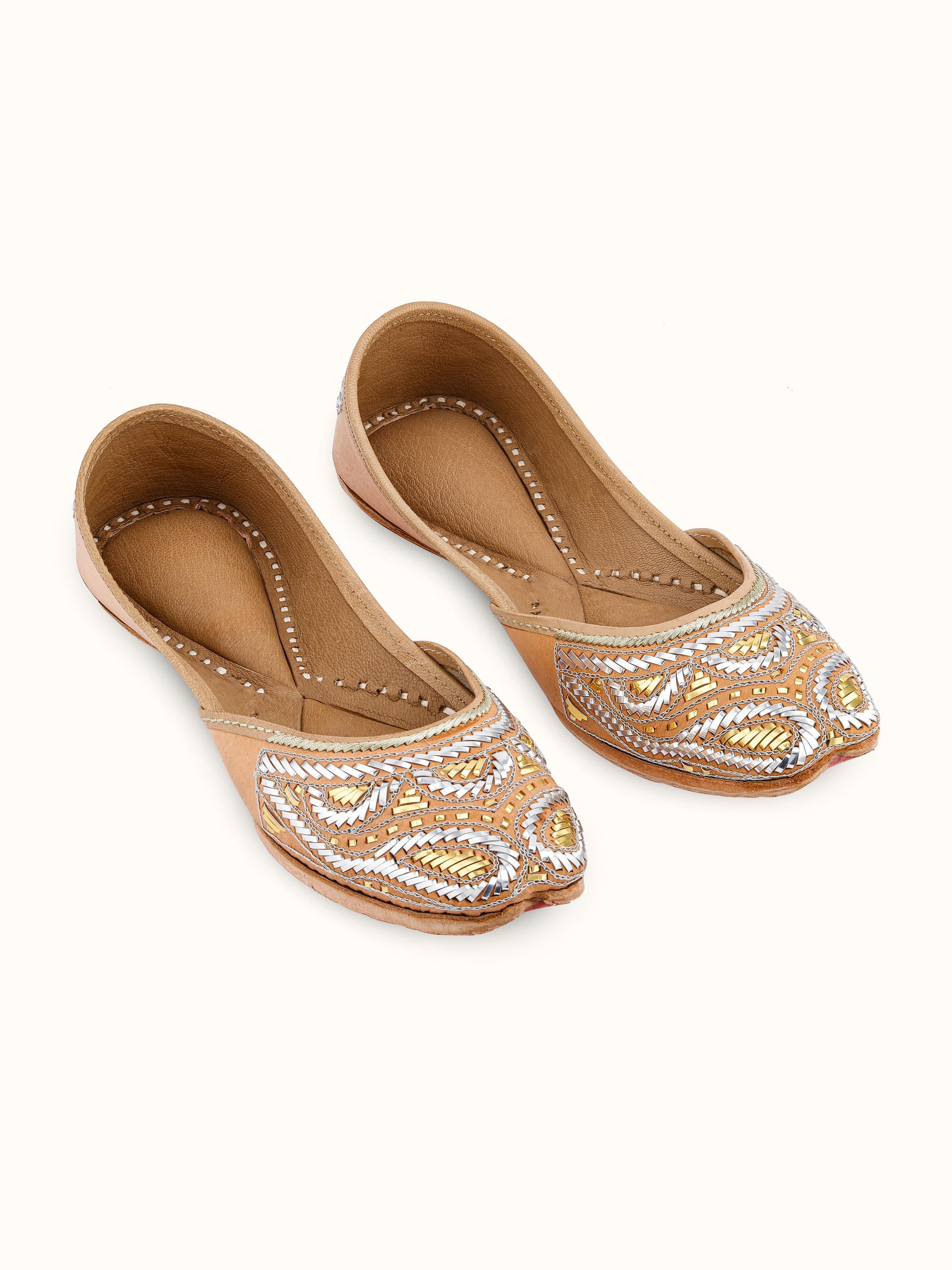 Front view of Ecru Leather Haryana Juttis showcasing traditional design and detailed embroidery.