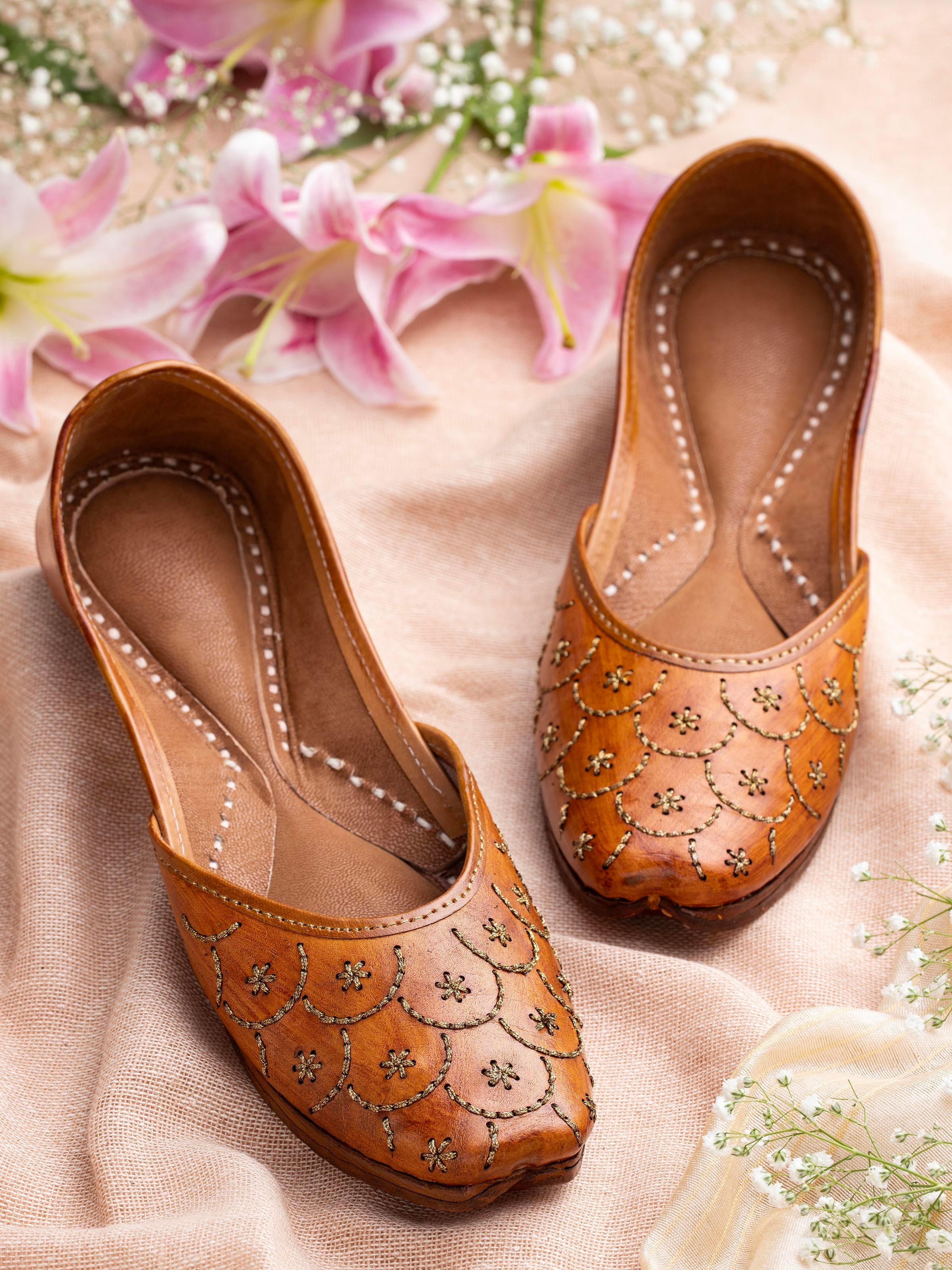 Side view of Mustard Leather Haryana Juttis highlighting the curved toe and handcrafted details.