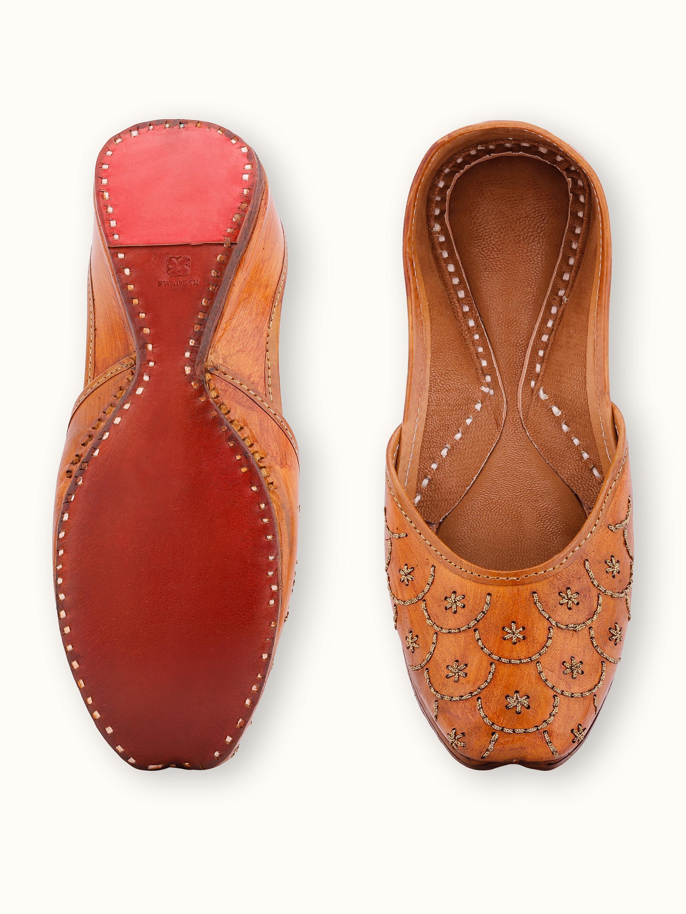 Top view of Mustard Leather Haryana Juttis highlighting the sole and decorative stitching.