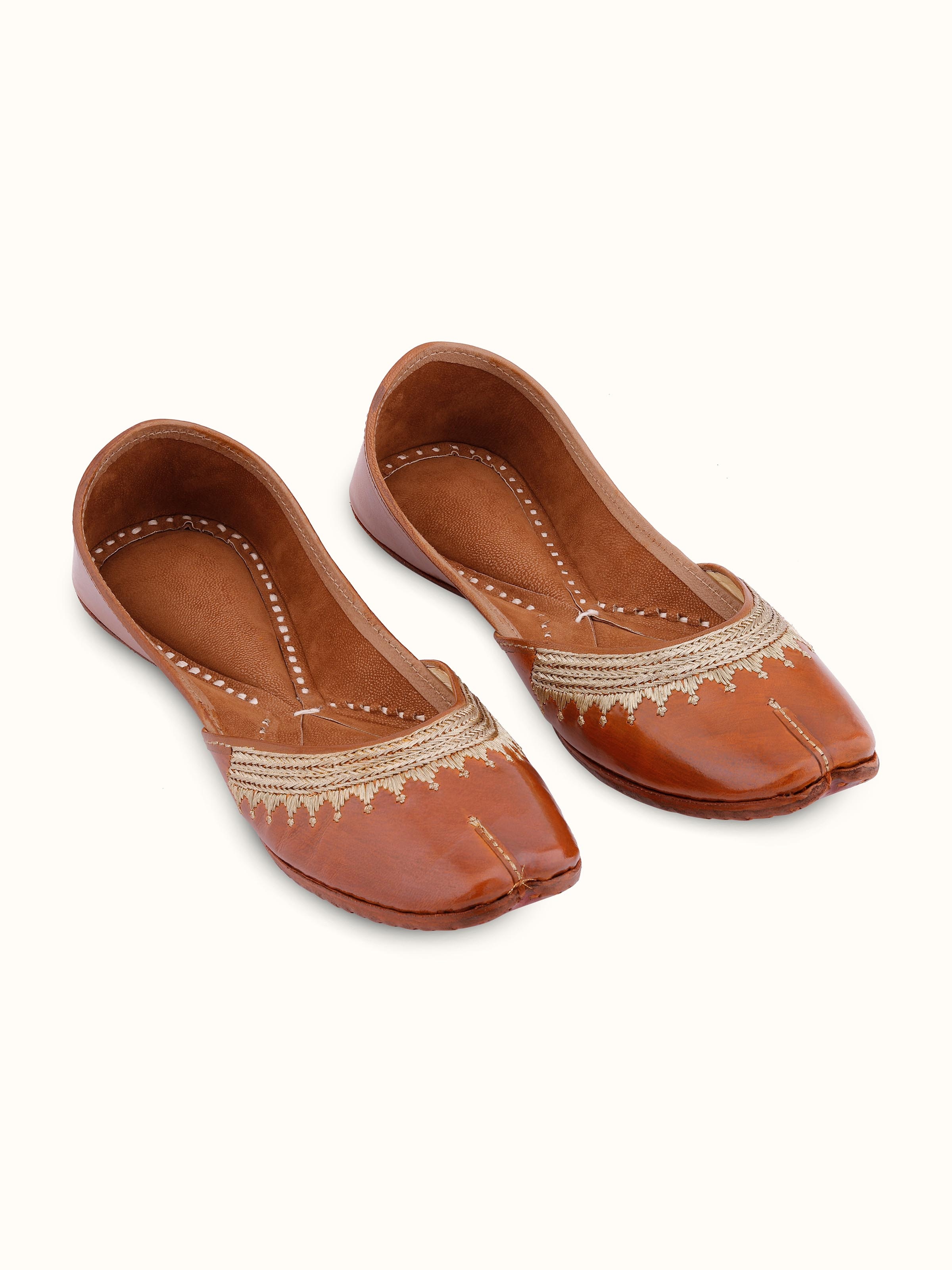 Front view of Mustard leather haryana juttis with detailed embroidery