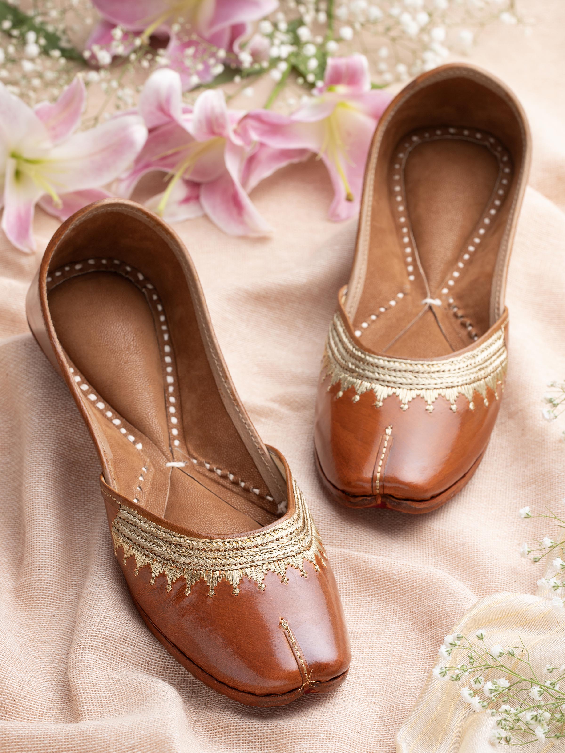 Side view of Mustard leather haryana juttis showcasing stitching design