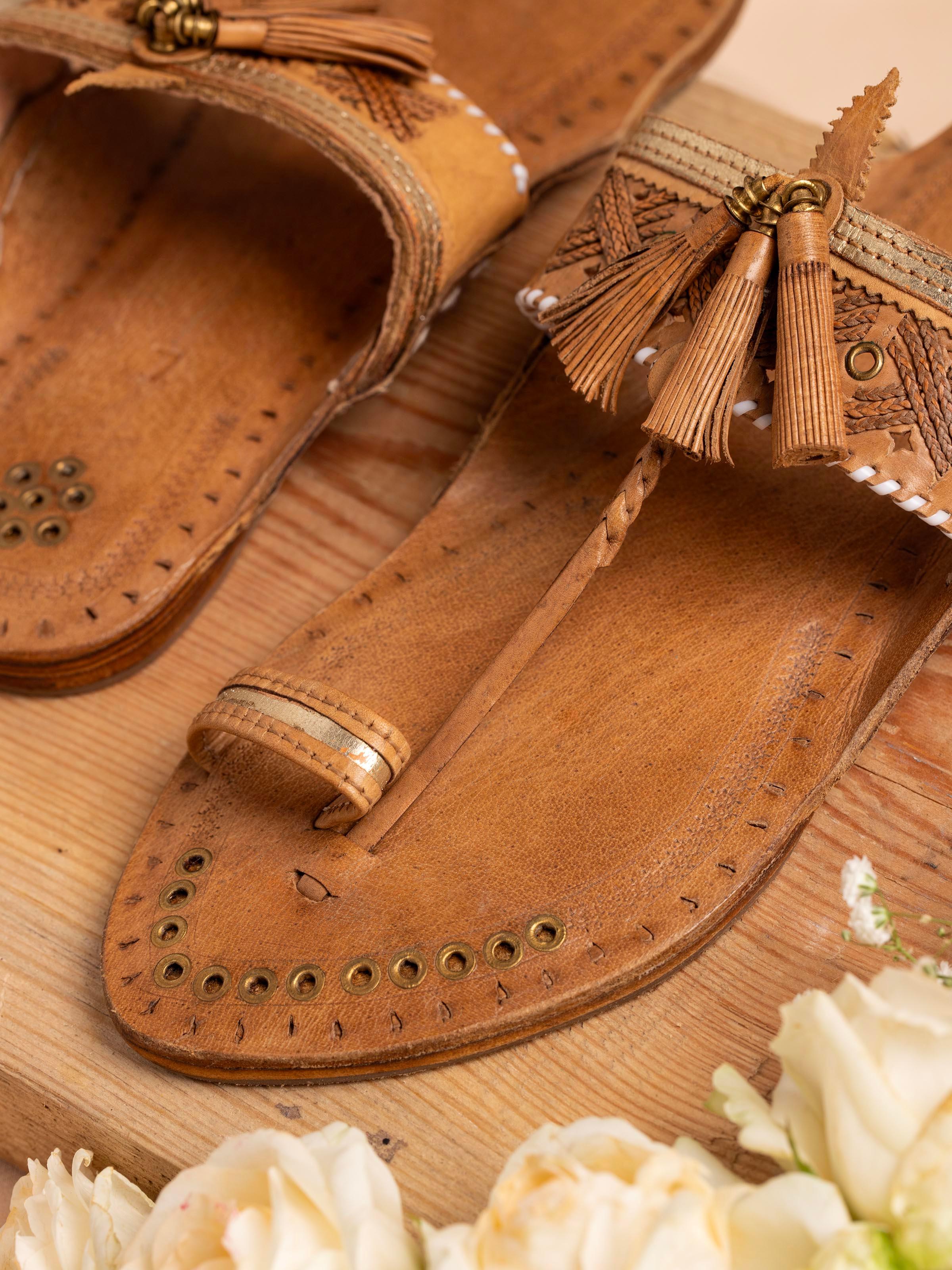 Close-up of Beige Leather Kolhapuri Flat Chappals focusing on the leather texture and craftsmanship.