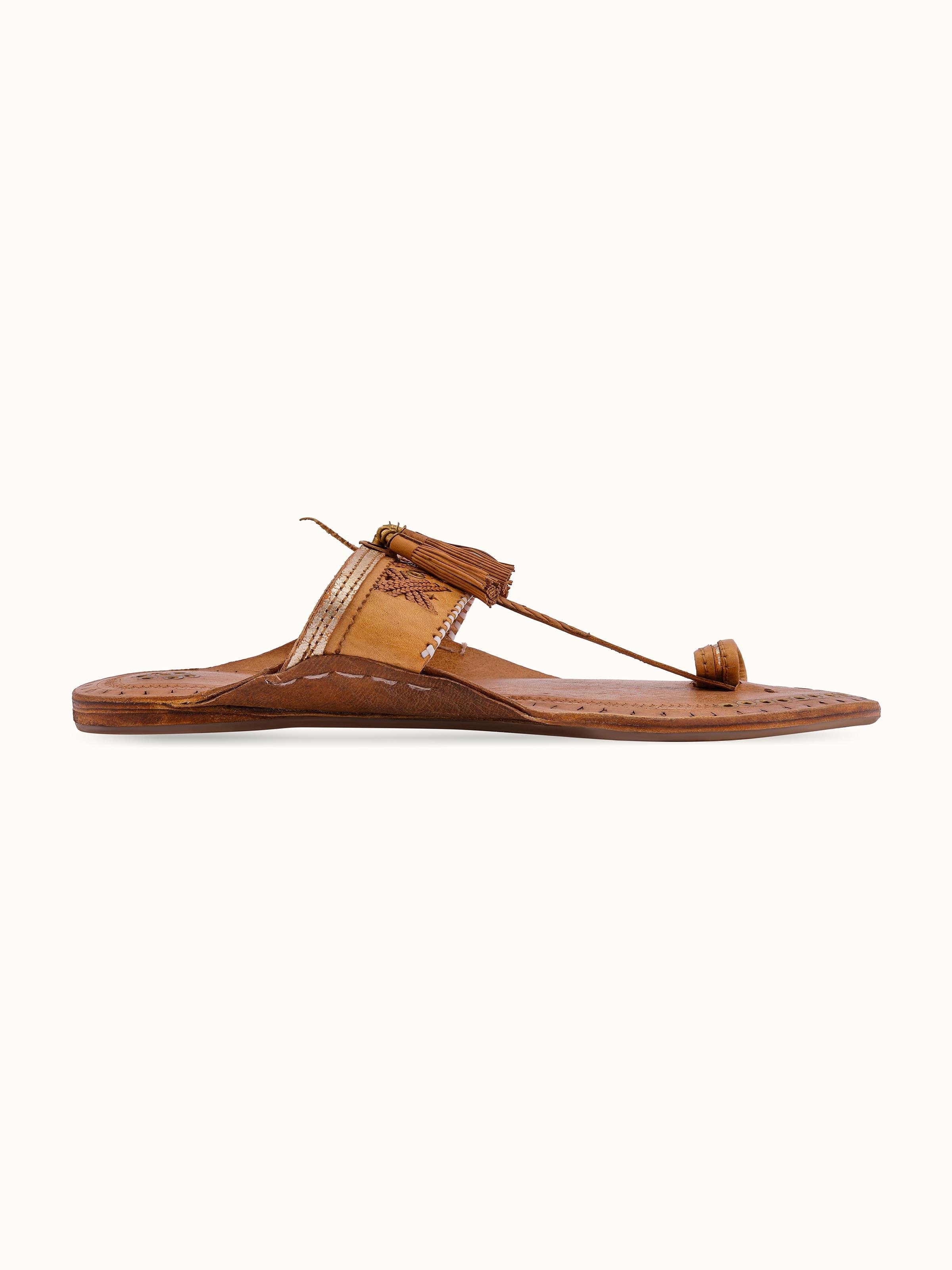 Angled view of Beige Leather Kolhapuri Flat Chappals showing the arch and sole design.