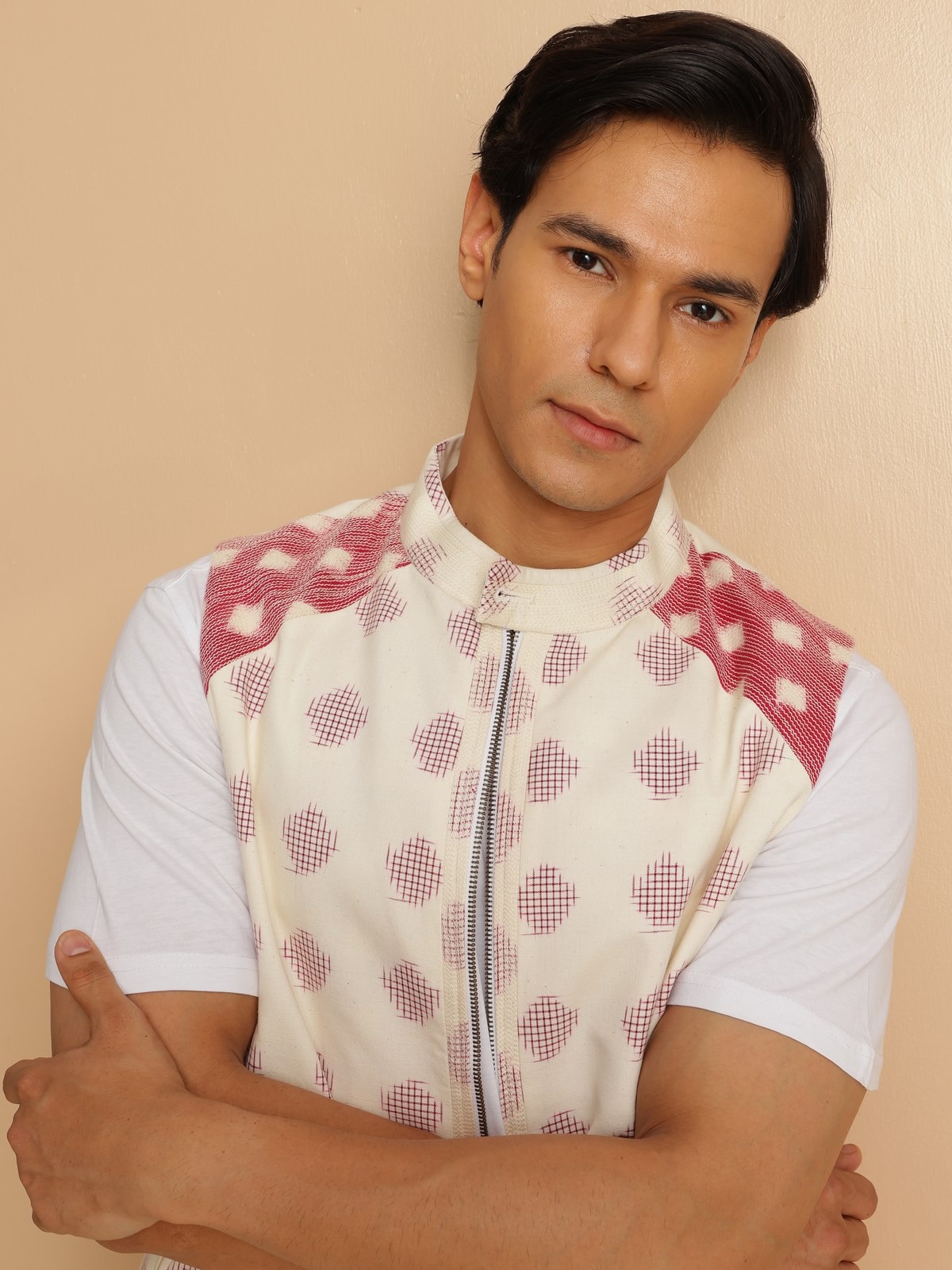 Side lifestyle view of sleeveless Telangana Ikat jacket with structured silhouette