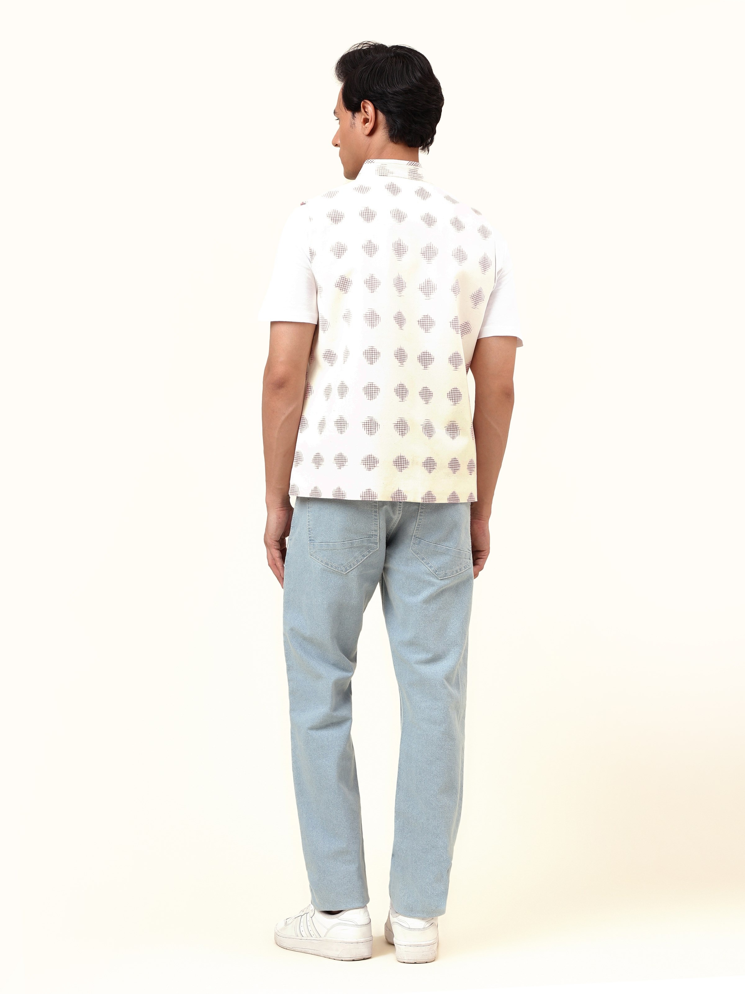 Back view of white Telangana Ikat jacket highlighting precise alignment of handwoven design