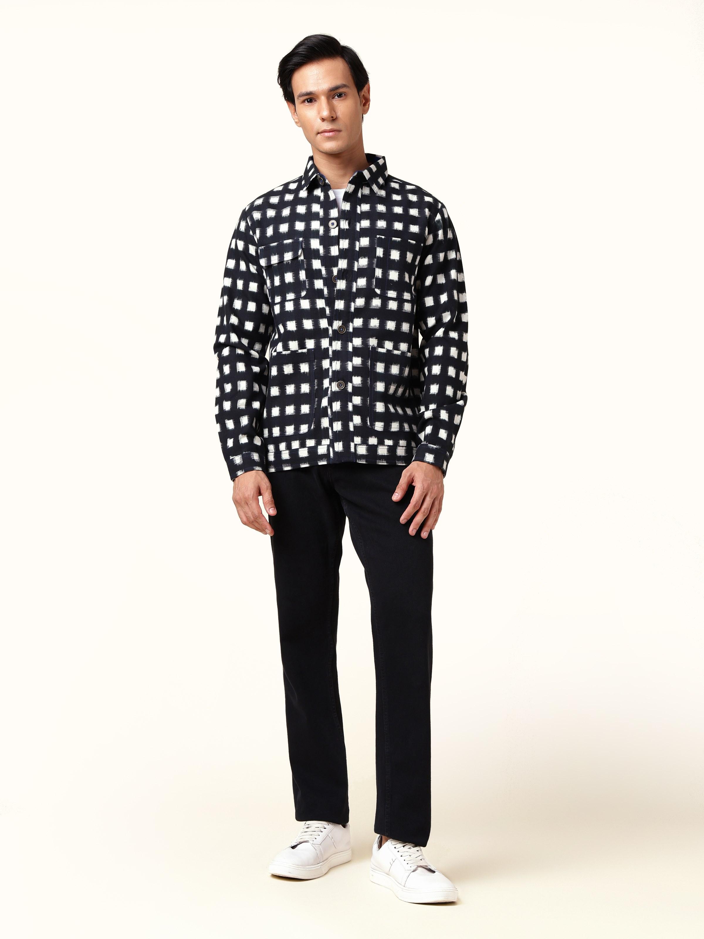 Front view of black cotton bomber jacket featuring Telangana Ikat patterns.