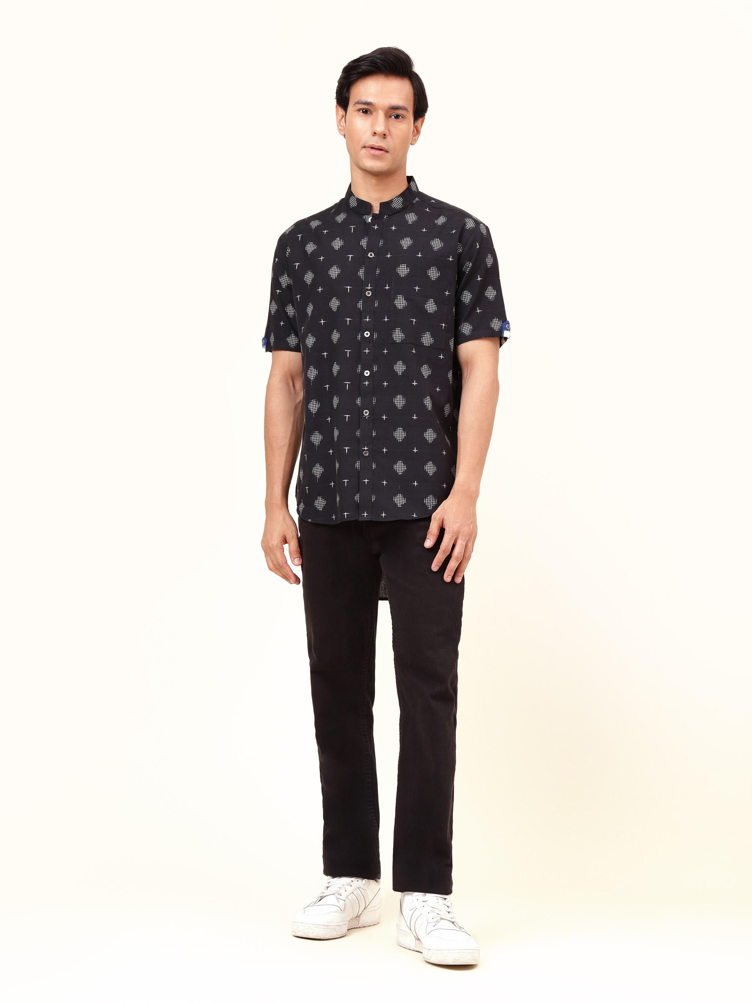 Front view of the black cotton Telangana Ikat shirt featuring the bold geometric patterns that define this traditional weave.