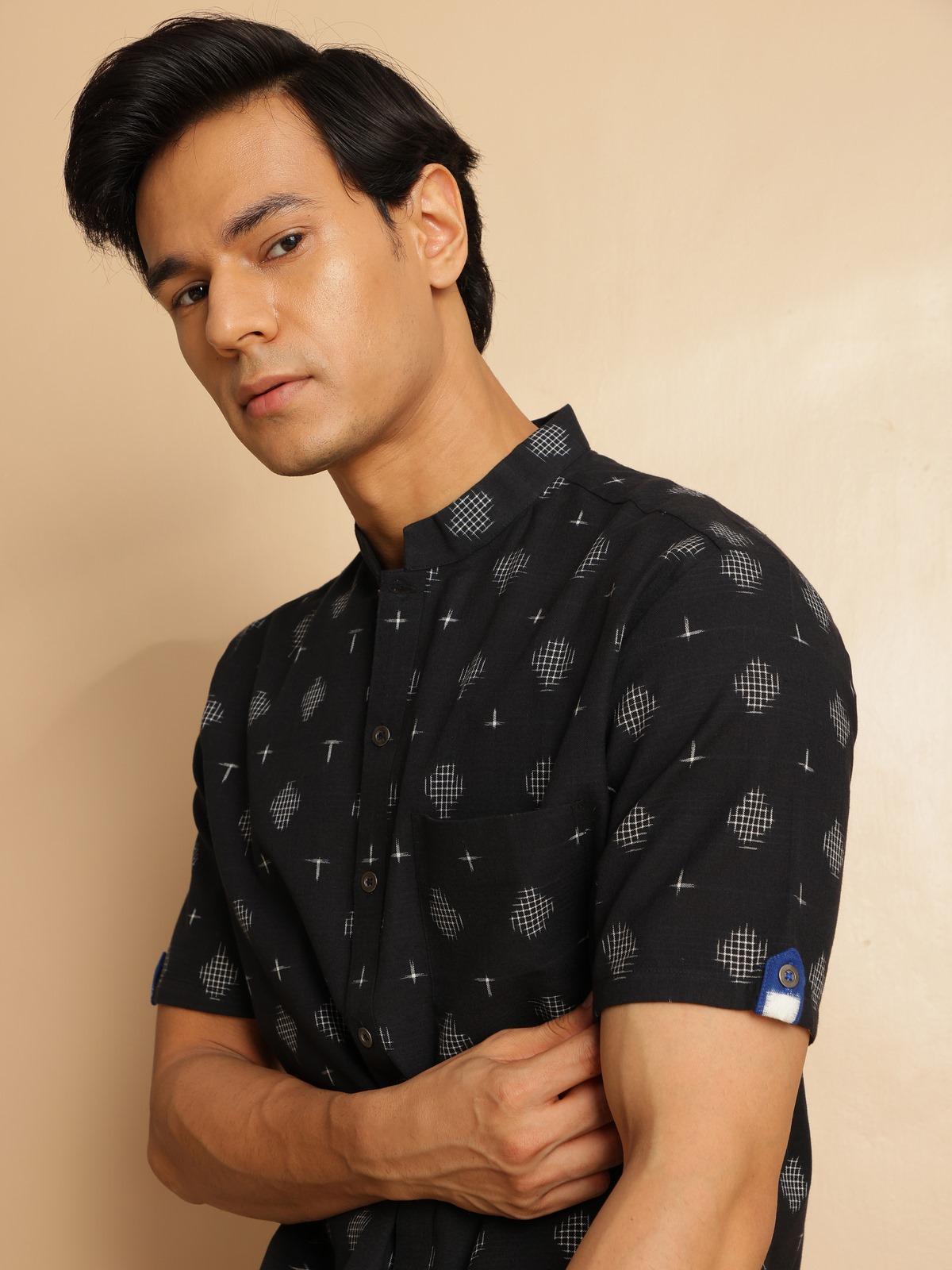 Another lifestyle angle showing the easy styling options with this Ikat shirt.