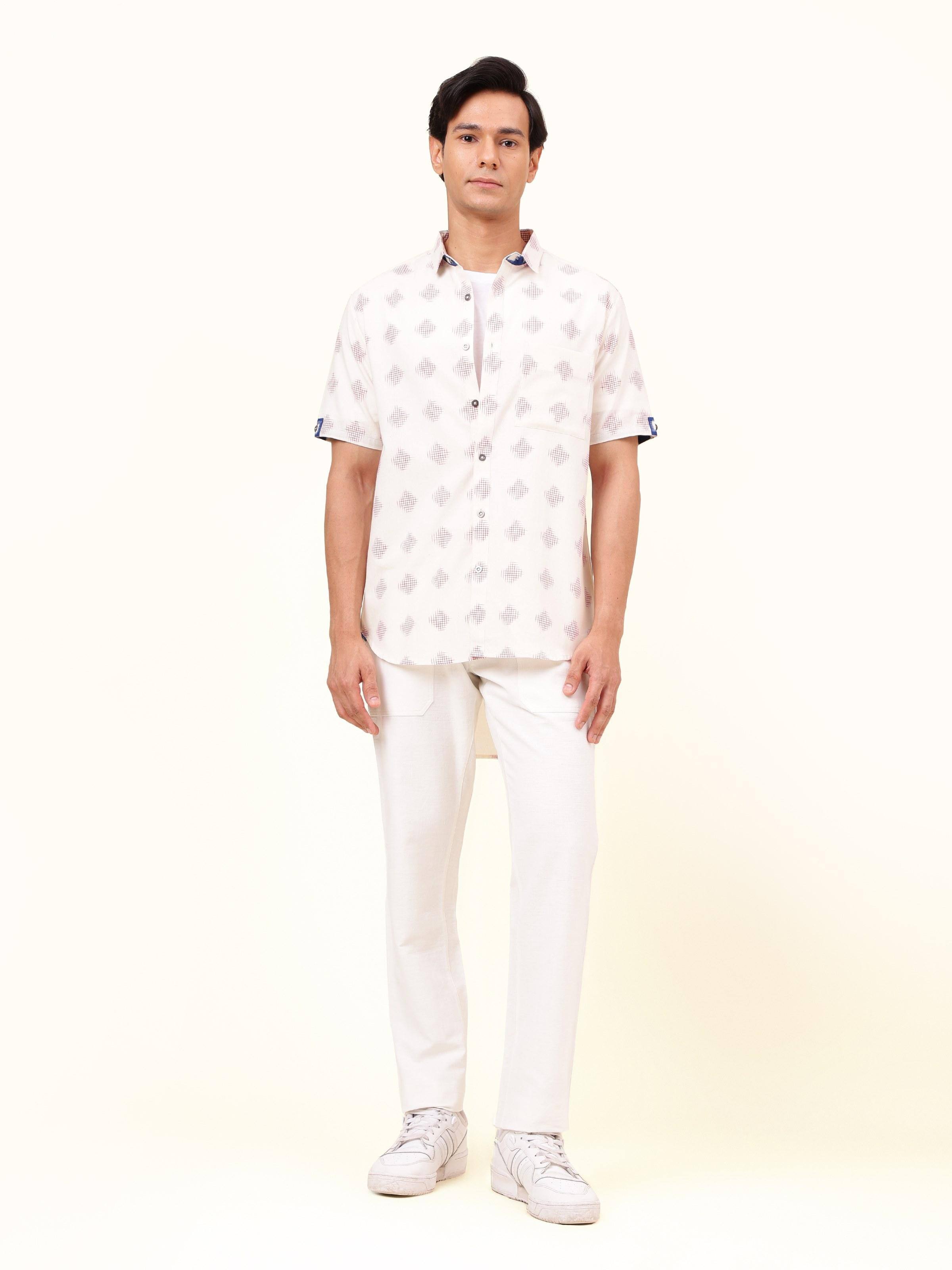 Front view of white cotton Telangana Ikat shirt featuring traditional geometric weave