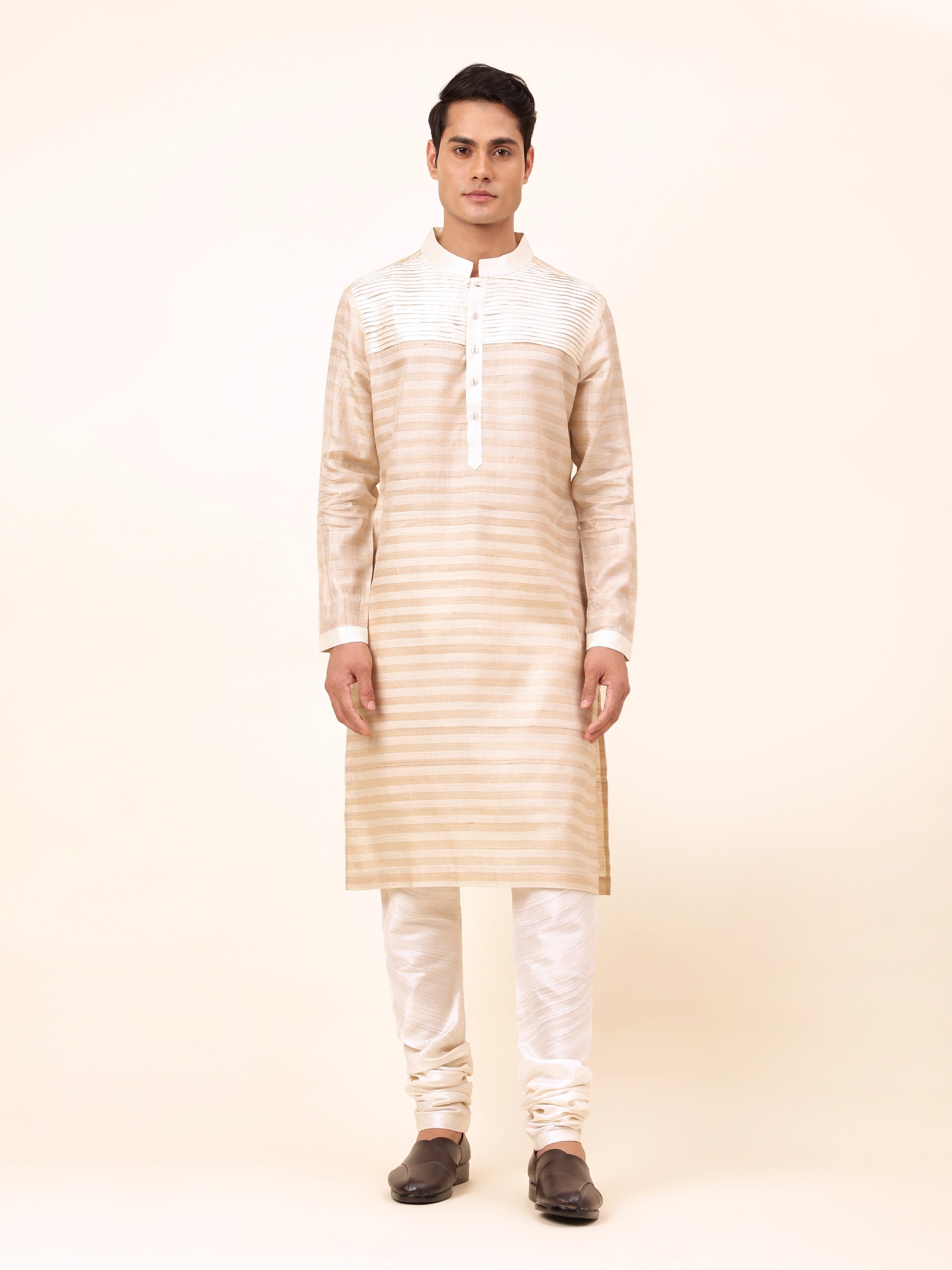 Front view of beige long kurta crafted in tussar silk with minimal design.
