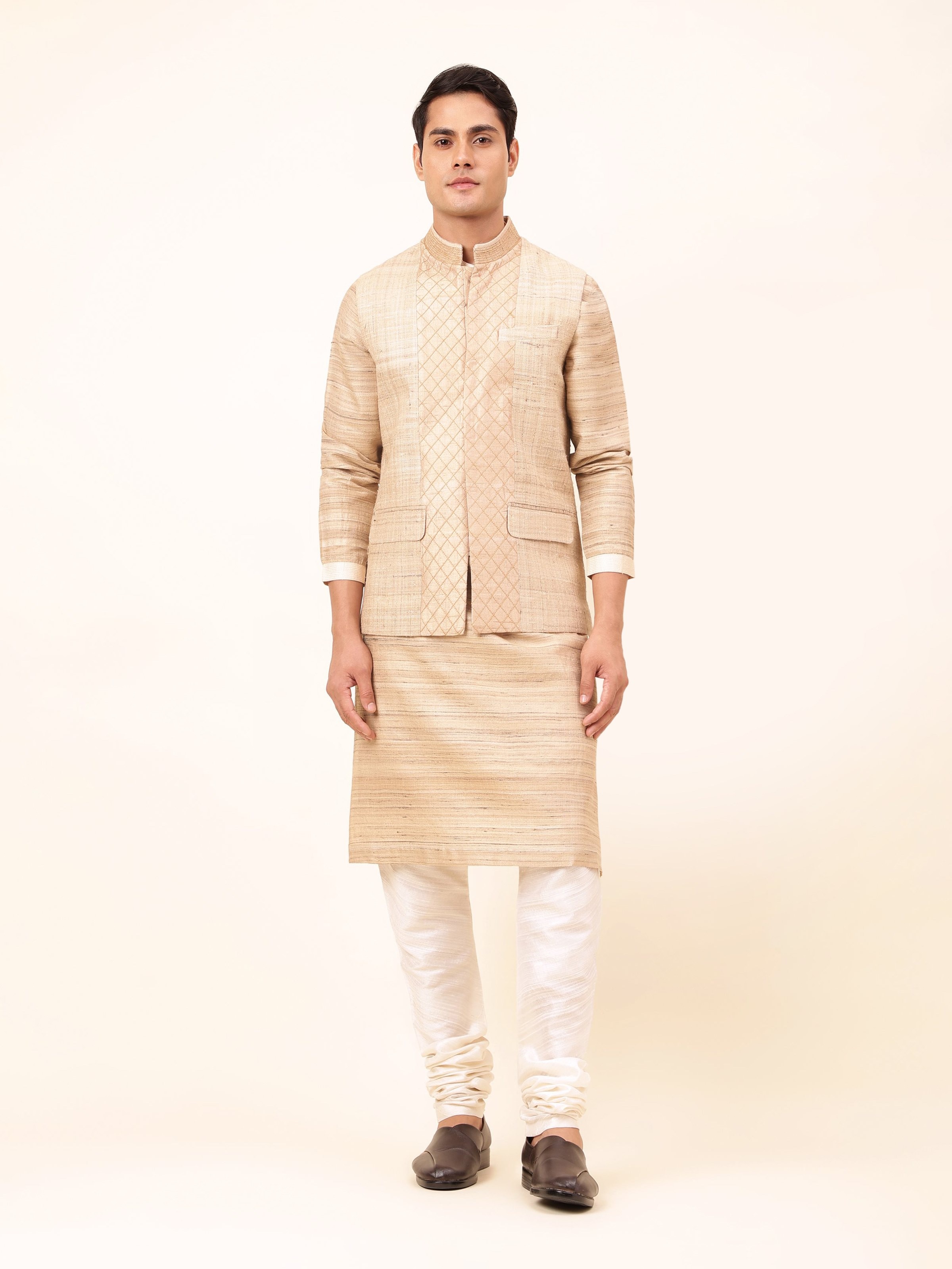 Front view of beige Tussar silk sleeveless jacket featuring subtle sheen and traditional fabric.