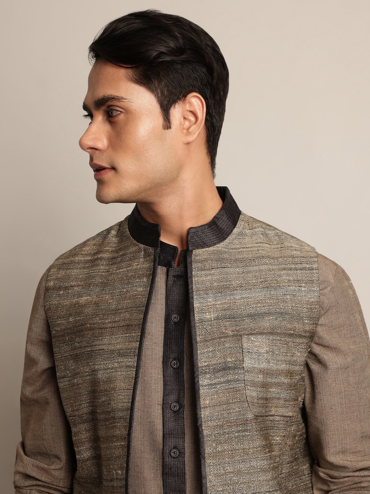 Alternate lifestyle image showcasing styling versatility of light grey silk jacket.