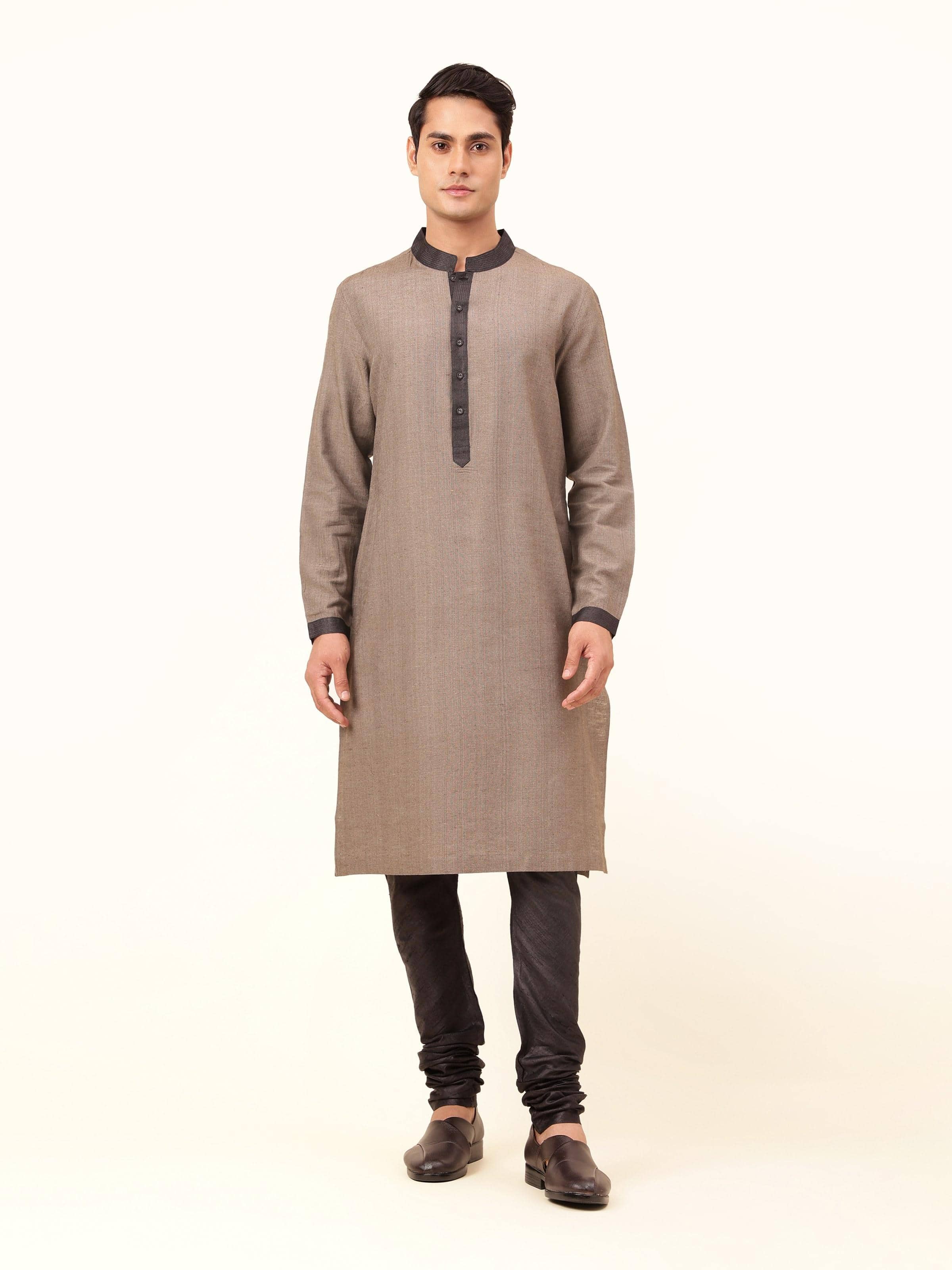 Front view of light brown Tussar silk long kurta with band collar and button placket.