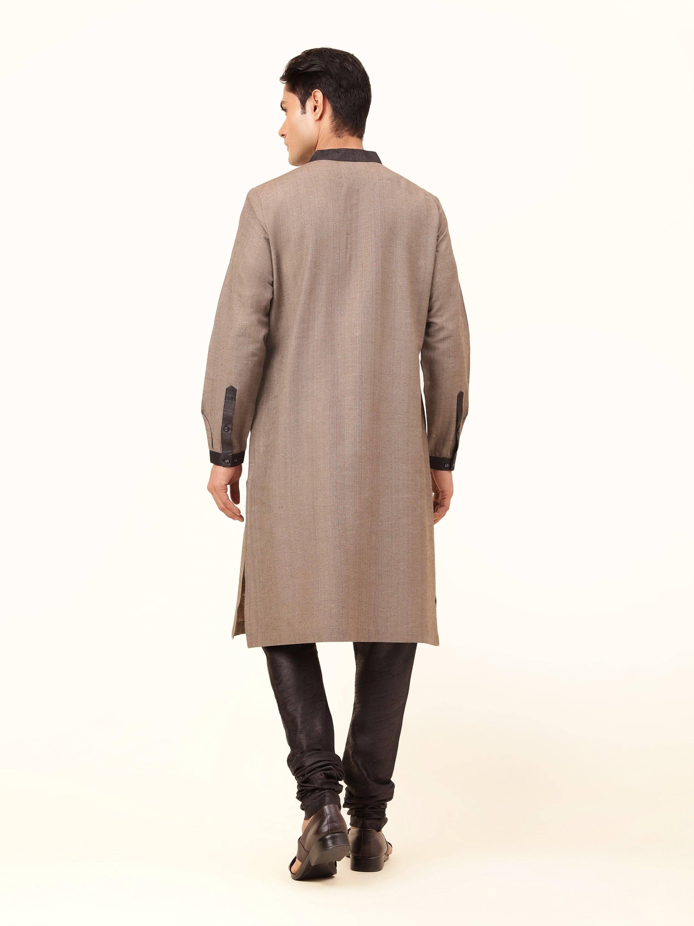 Back view of light brown Tussar silk long kurta showing clean finish and length.
