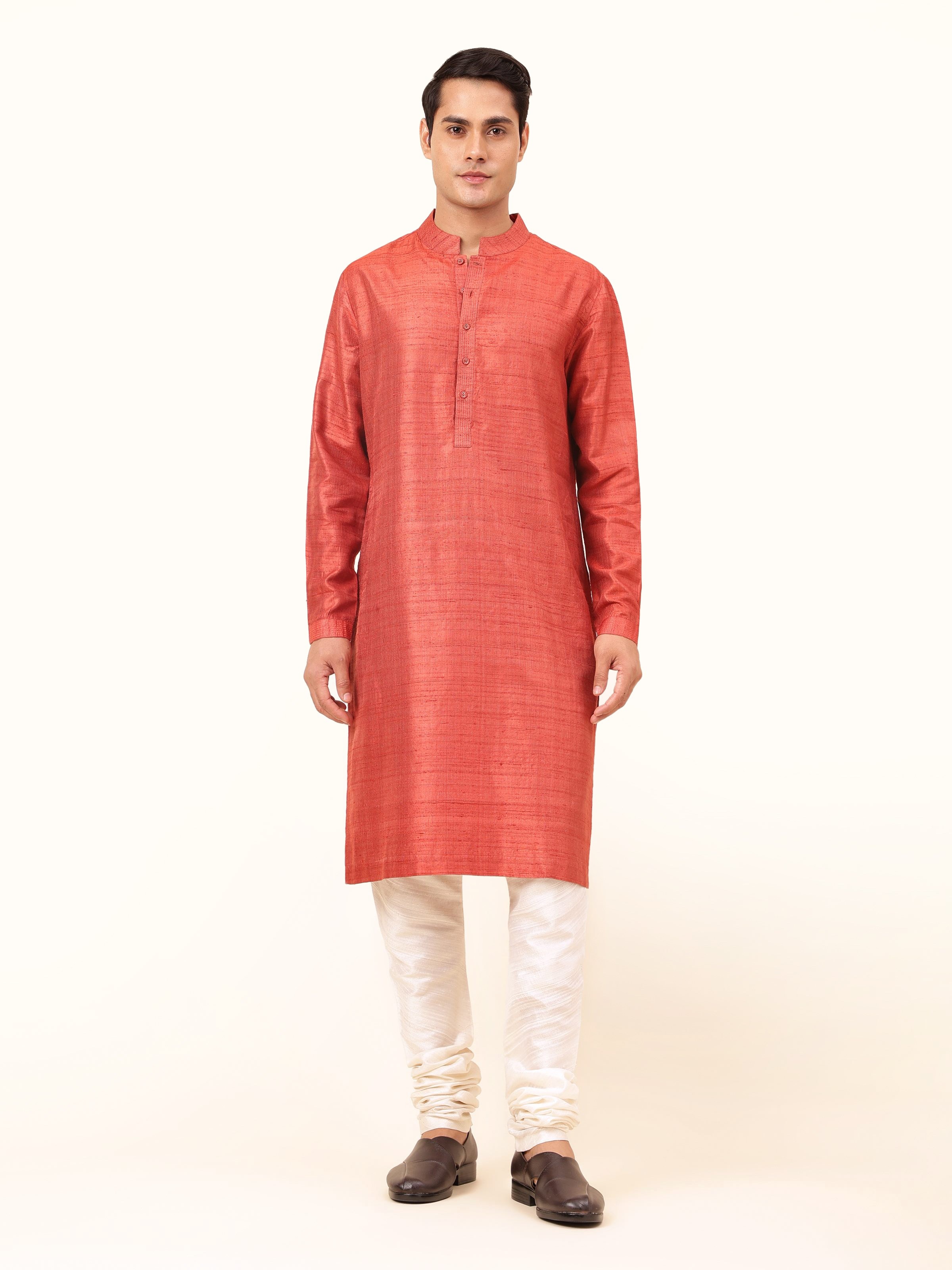 Front view highlighting the rich maroon silk and simple, elegant tailoring of the long kurta.