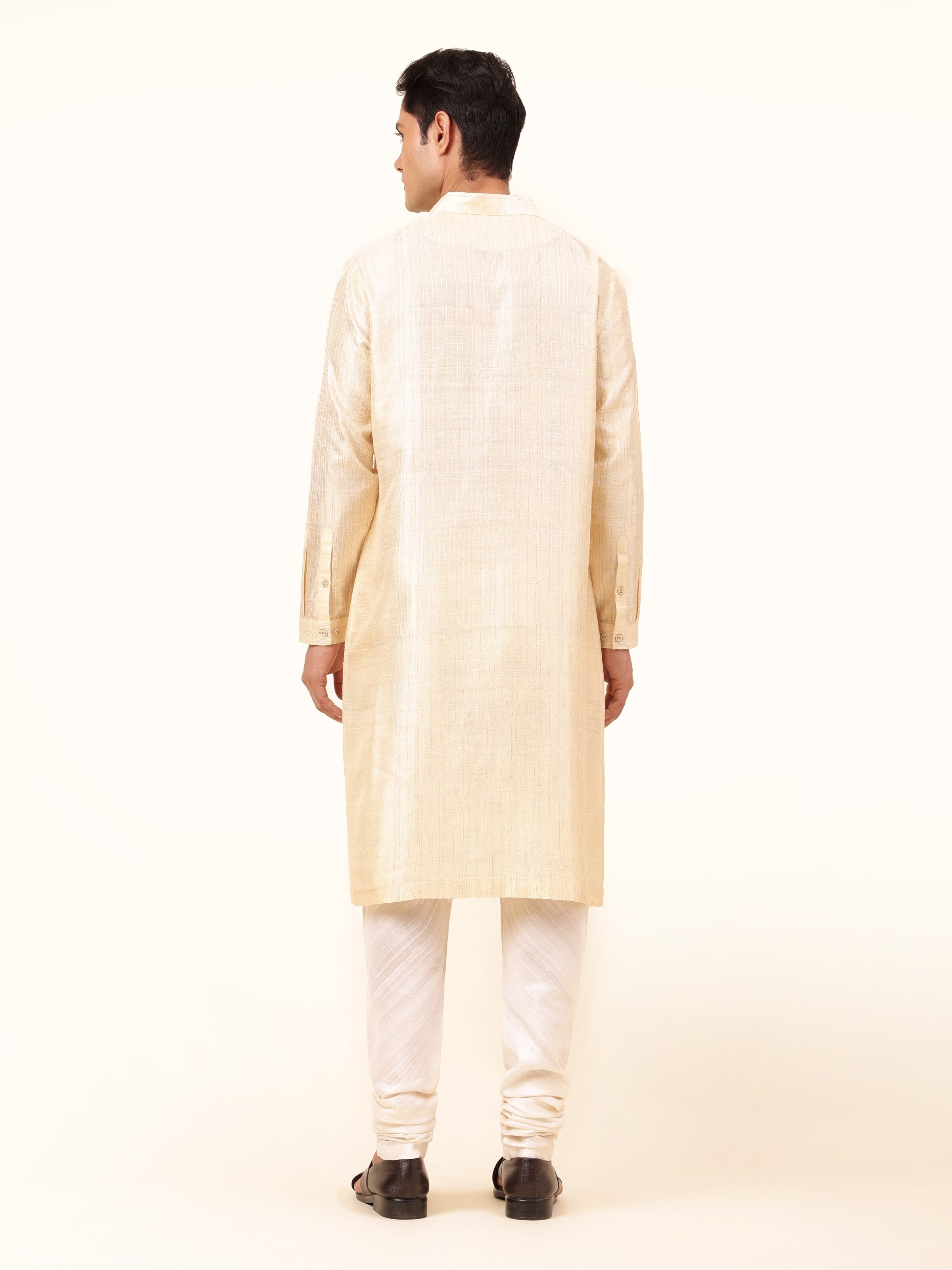Back view showing the classic cut and refined texture of the kurta.