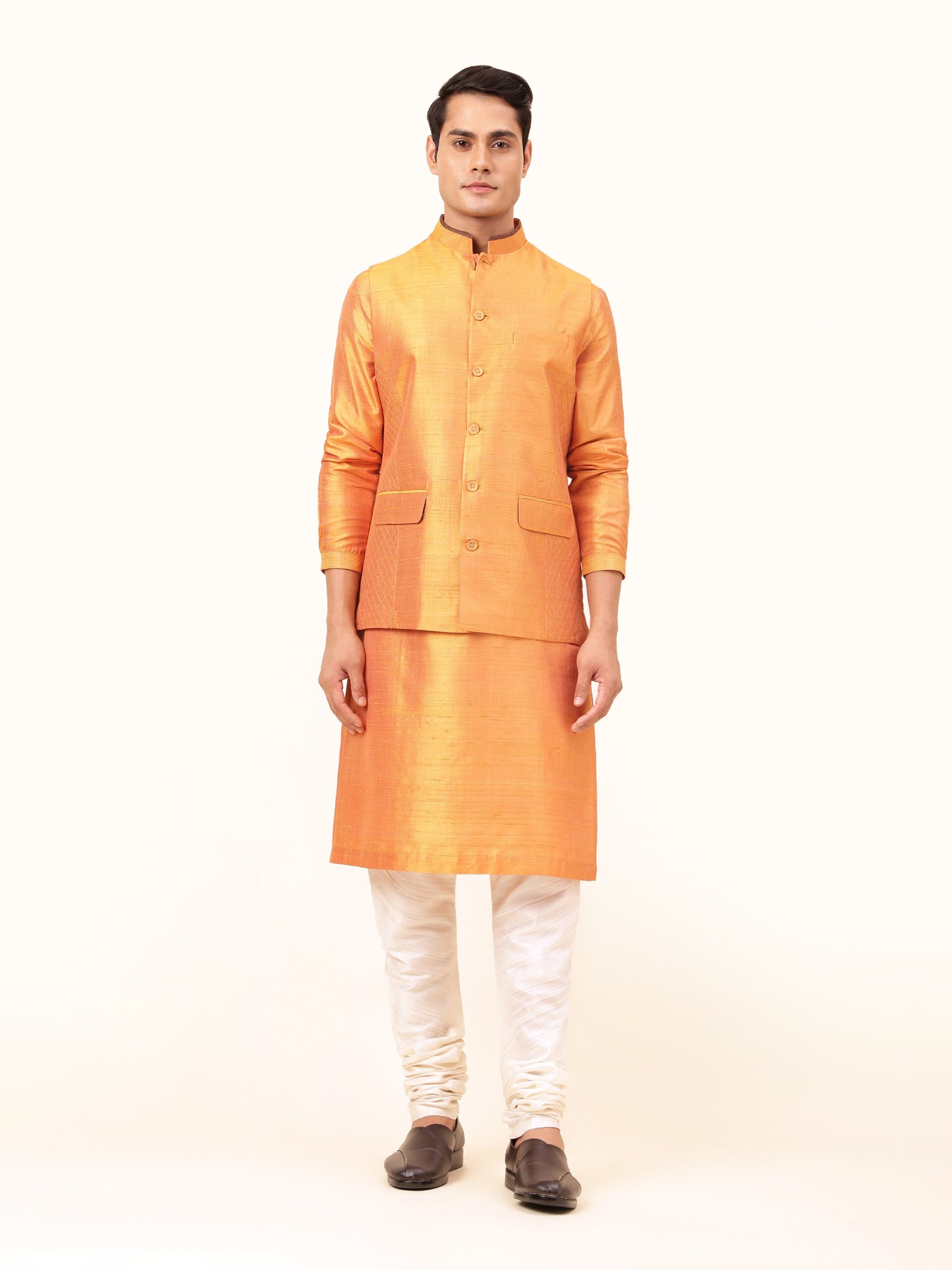 Front view of mustard mulberry silk sleeveless jacket with smooth texture and tailored fit