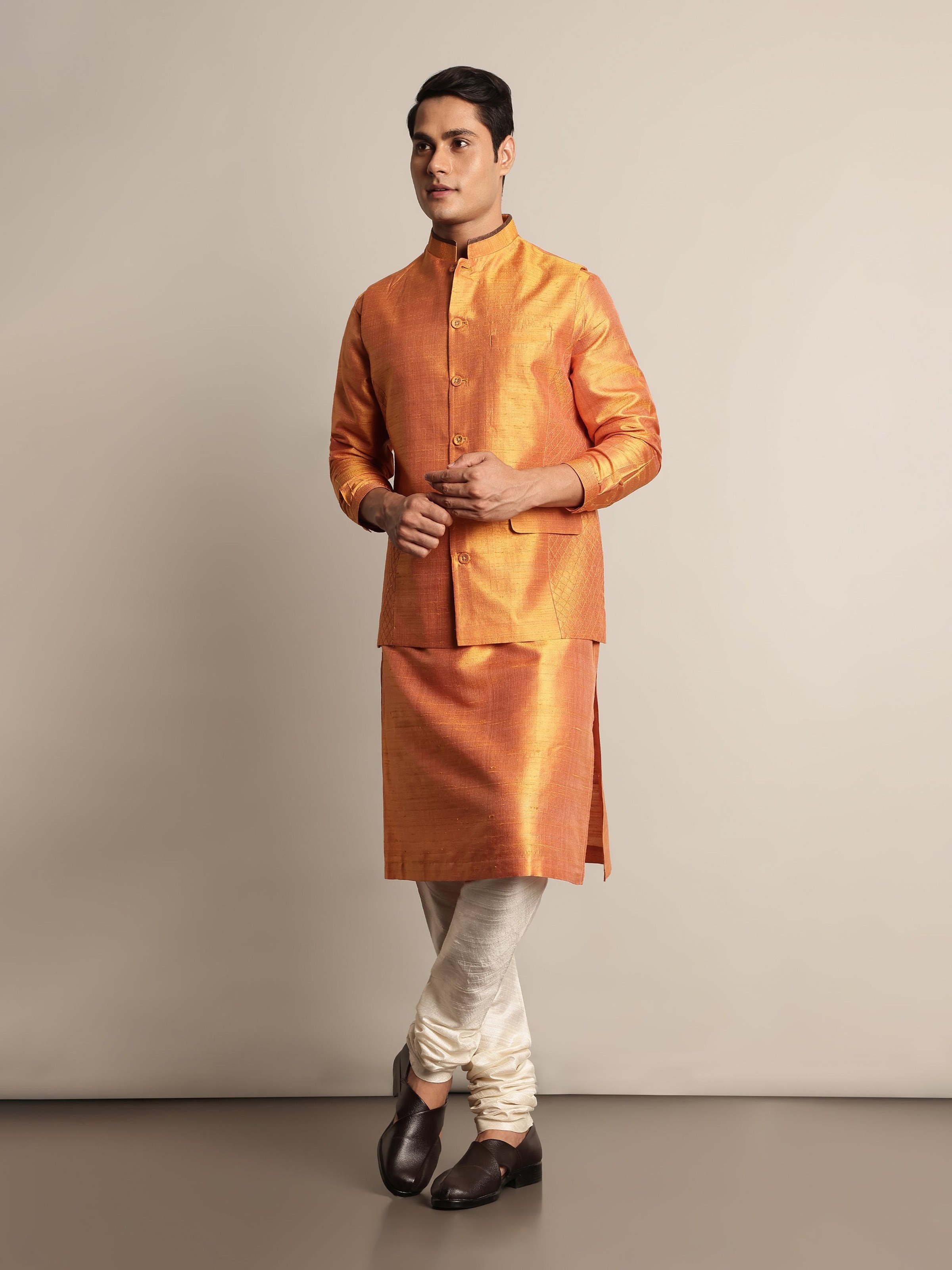 Lifestyle view of mustard mulberry silk sleeveless jacket styled with coordinating outfit
