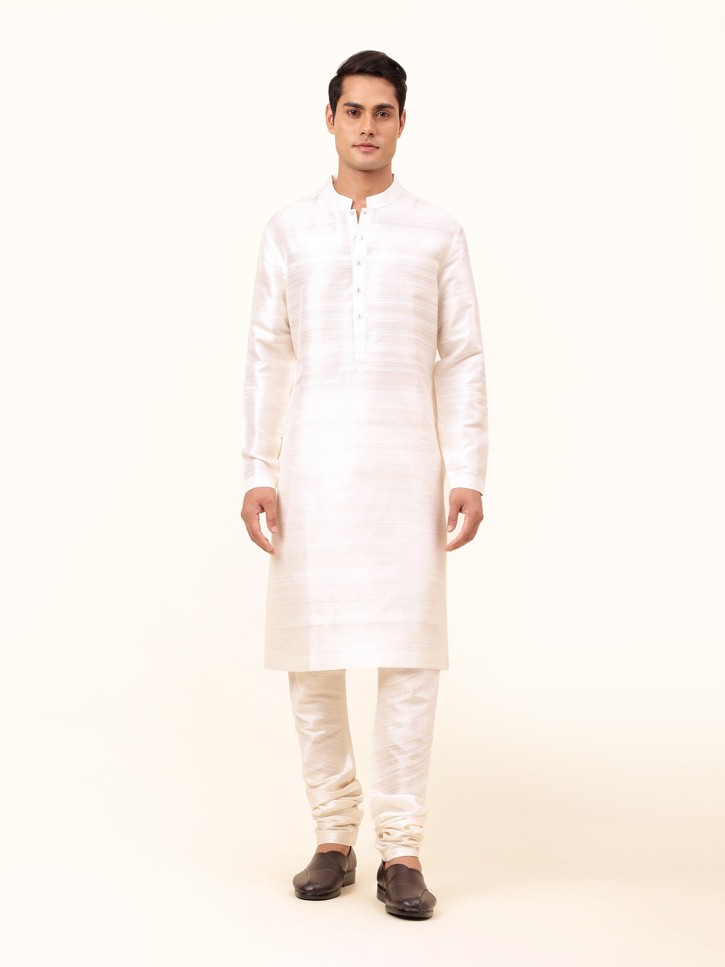 Front view of off-white silk long kurta with straight cut silhouette and minimal detailing